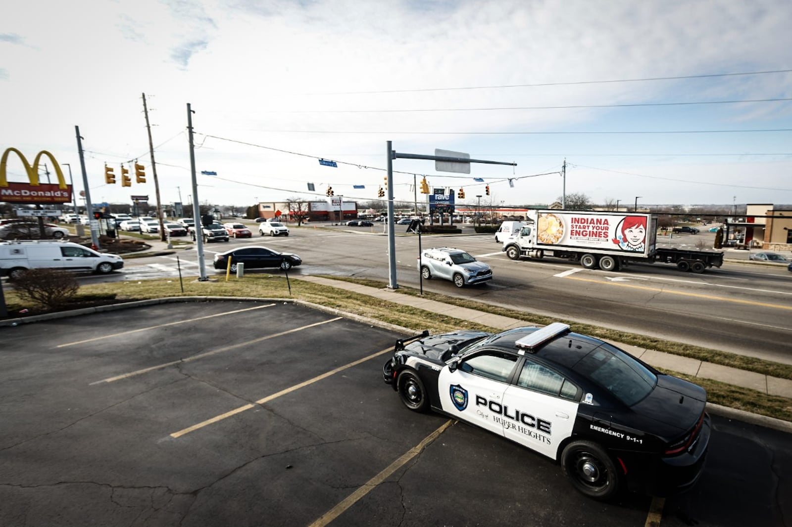 The Huber Heights intersection of Old Troy Pike and Merily Way near I-70 is being monitored by Huber Heights police Thursday January 5, 2023. Residents have asked police to monitor the intersection in response to mounting concerns regarding motorists who are turning left onto Merily Way and blocking the intersection. JIM NOELKER/STAFF