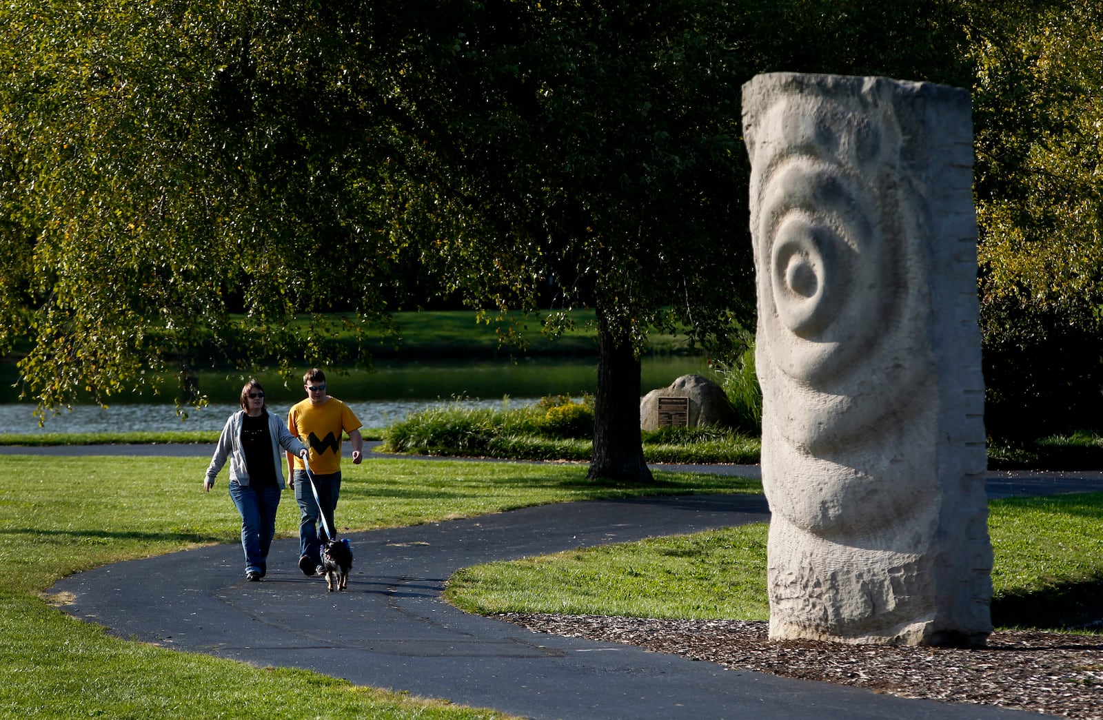 "Rock Waves" created from Indiana limestone by the artist Anno Sieberts, can be found in Kettering's Delco Park. LISA POWELL / STAFF