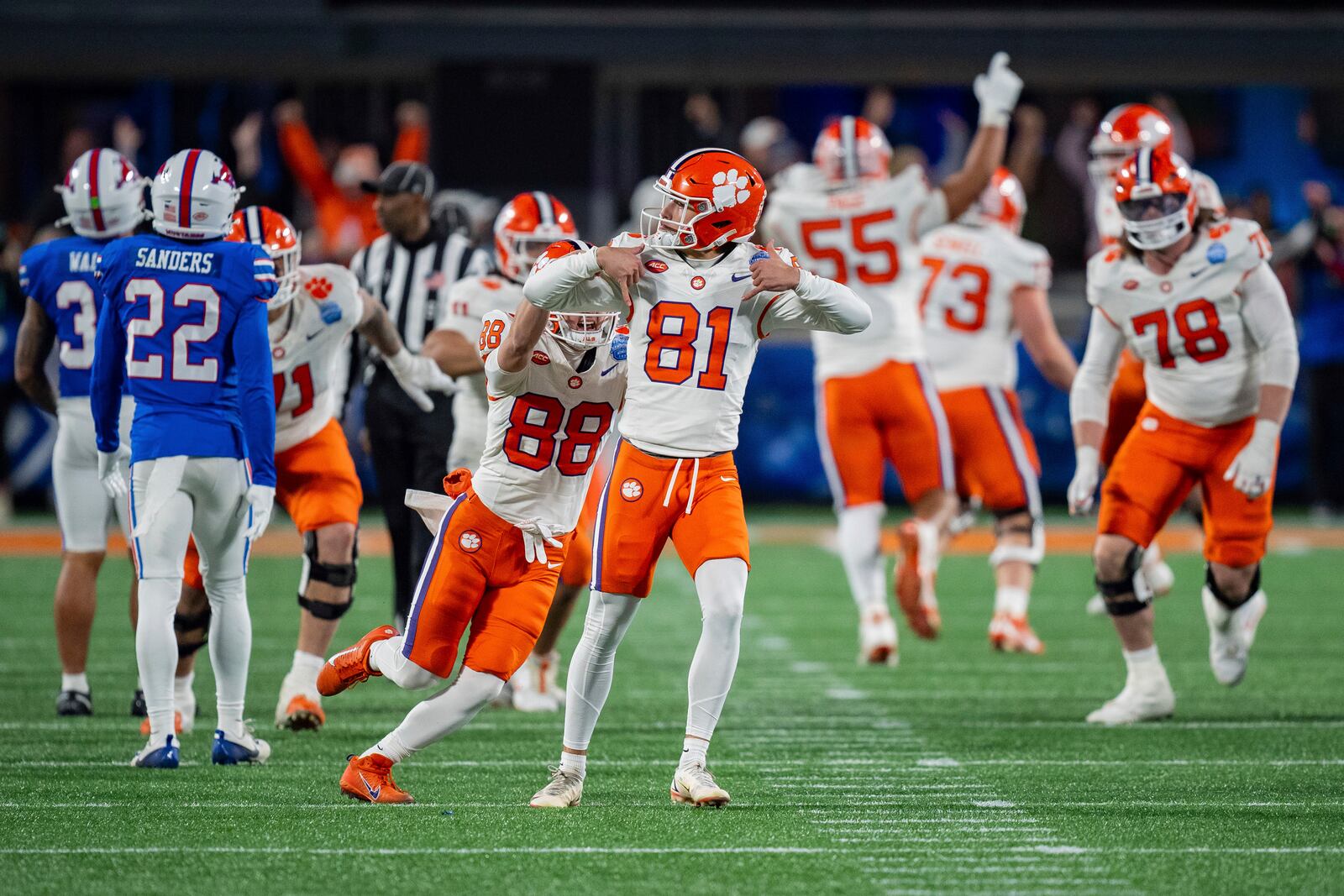 FILE - Clemson place kicker Nolan Hauser (81) reacts after kicking the game winning field goal in the Atlantic Coast Conference championship NCAA college football game against SMU Saturday, Dec. 7, 2024, in Charlotte, N.C. (AP Photo/Jacob Kupferman, FIle)