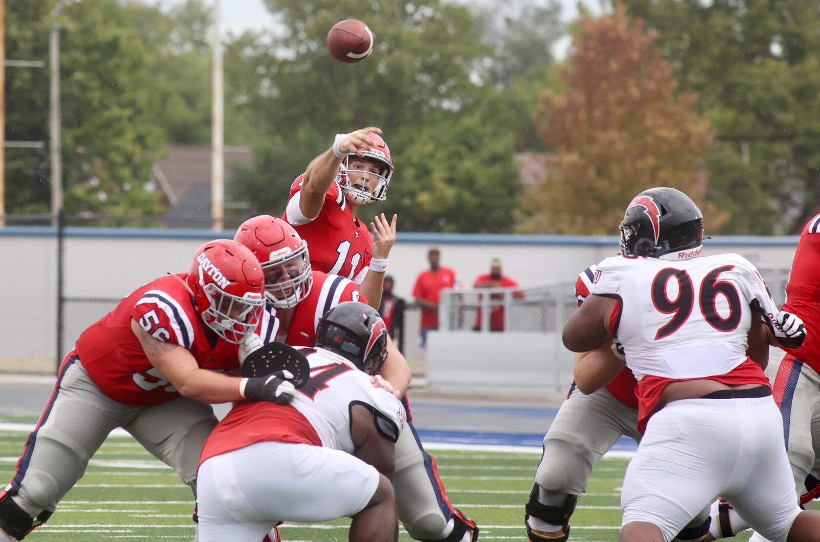 Dayton's Drew VanVleet throws a touchdown pass in the first quarter against St. Francis on Saturday, Aug. 31, 2024, at Welcome Stadium in Dayton. David Jablonski/Staff