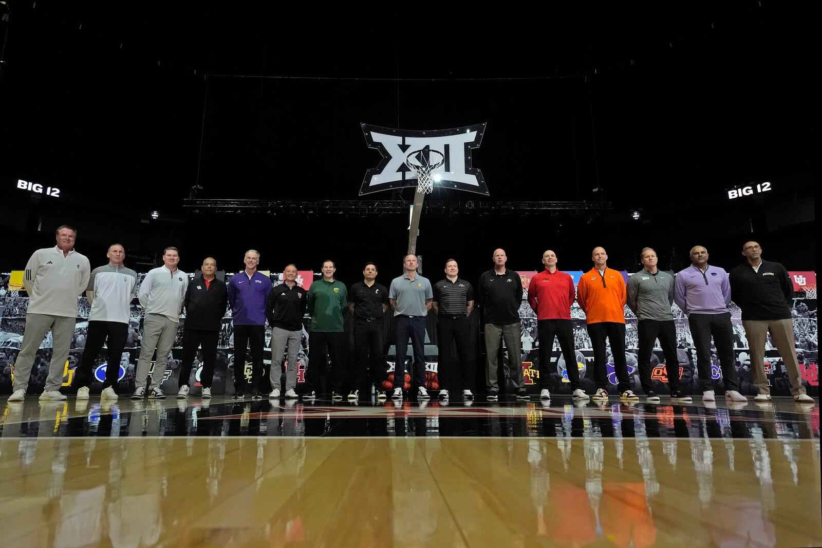 Big 12 coaches pose for a photo during the NCAA college Big 12 men's basketball media day, Wednesday, Oct. 23, 2024, in Kansas City, Mo. (AP Photo/Charlie Riedel)