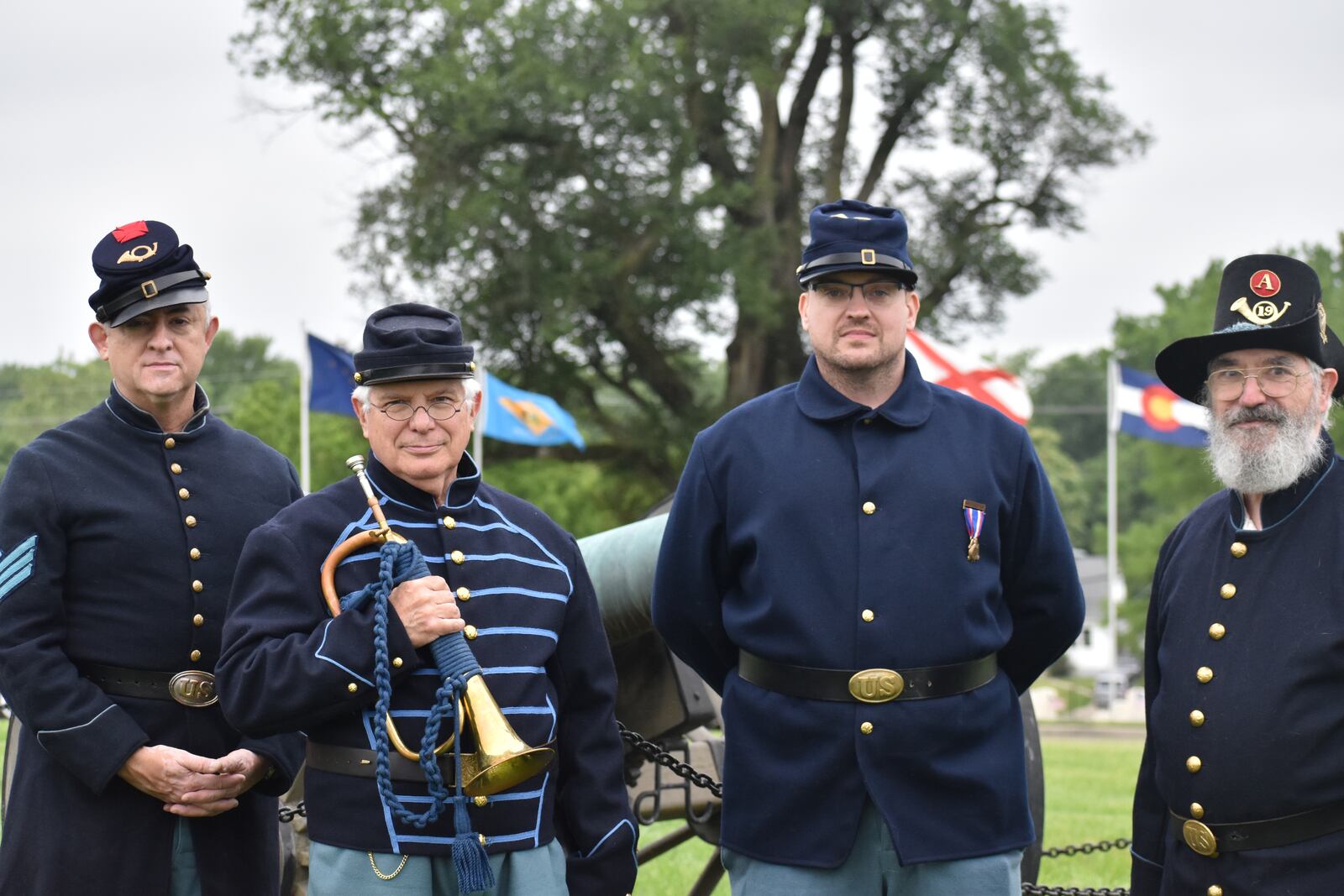 Members of the Sons of Union Veterans of the Civil War, including, from left to right, Alex Villalva, Al Howey, Gregory Hedgeorth, and Christopher Howey, during the Memorial Day ceremony at Dayton National Cemetery on Monday, May 27, 2024. SAM WILDOW\STAFF