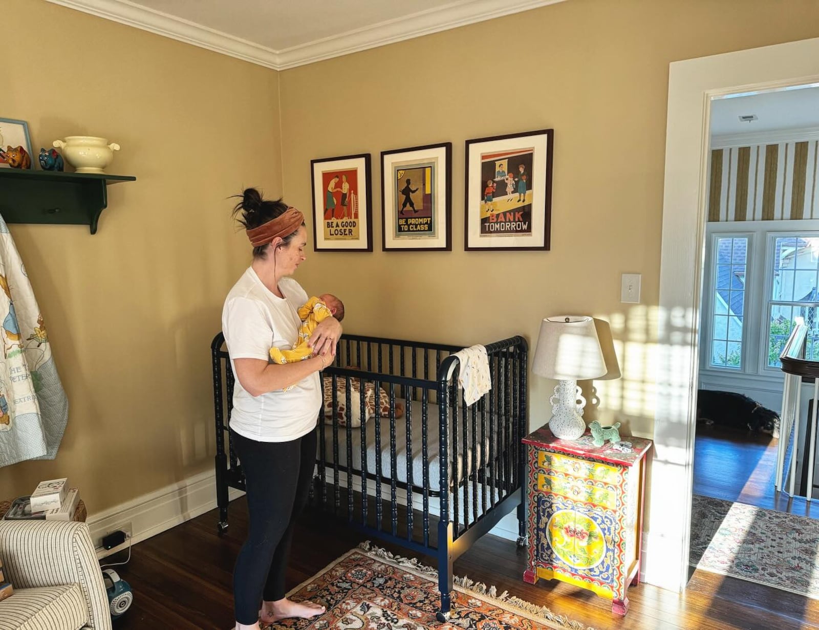 Jackson's son Perry was born in October of last year. She is shown holding him in his nursery in their home in Oakwood.