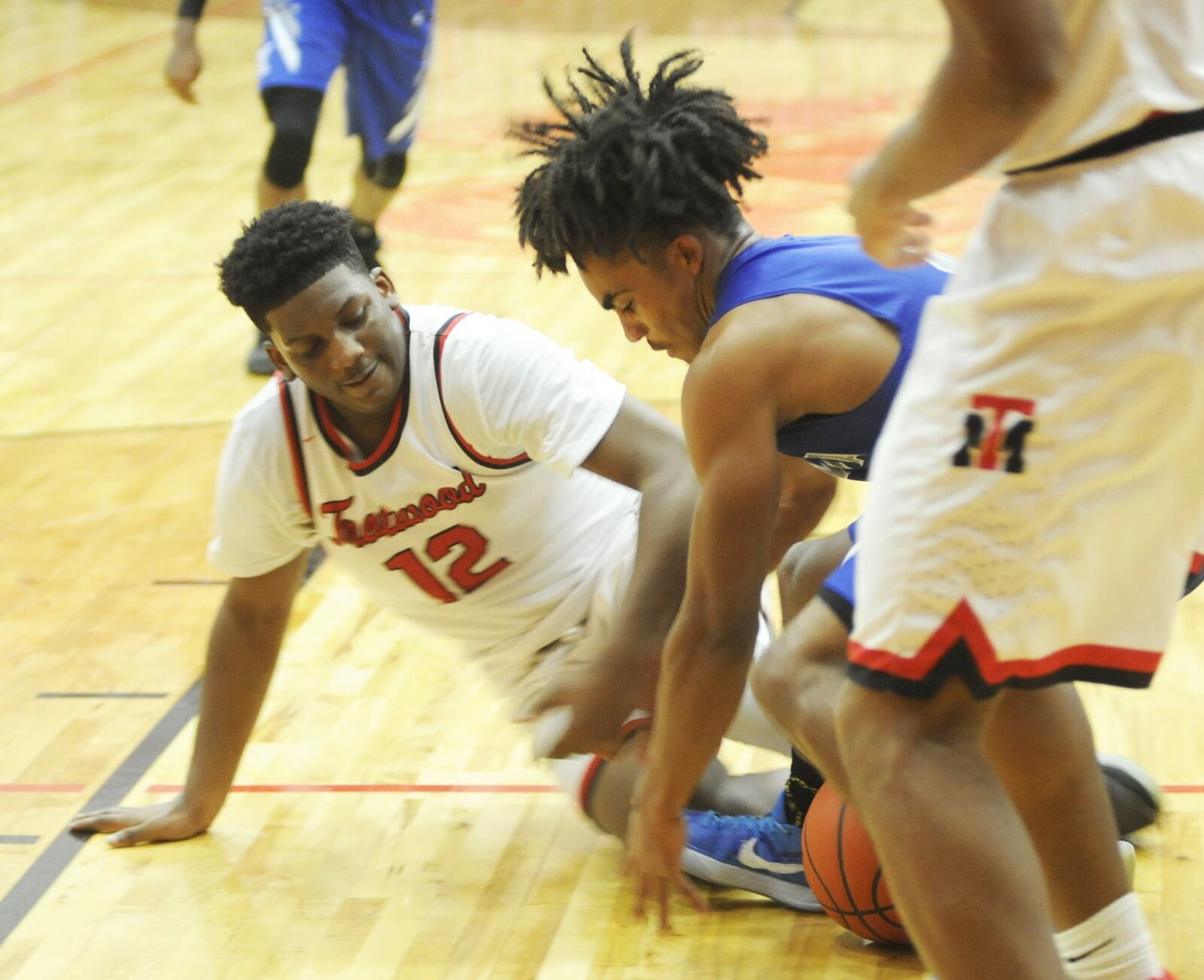 Trotwood’s Malachi Mathews (left) and Xenia’s Dylan Hoosier contend for a loose ball. Trotwood-Madison defeated visiting Xenia 95-60 in a boys high school basketball game on Friday, Dec. 14, 2018. MARC PENDLETON / STAFF