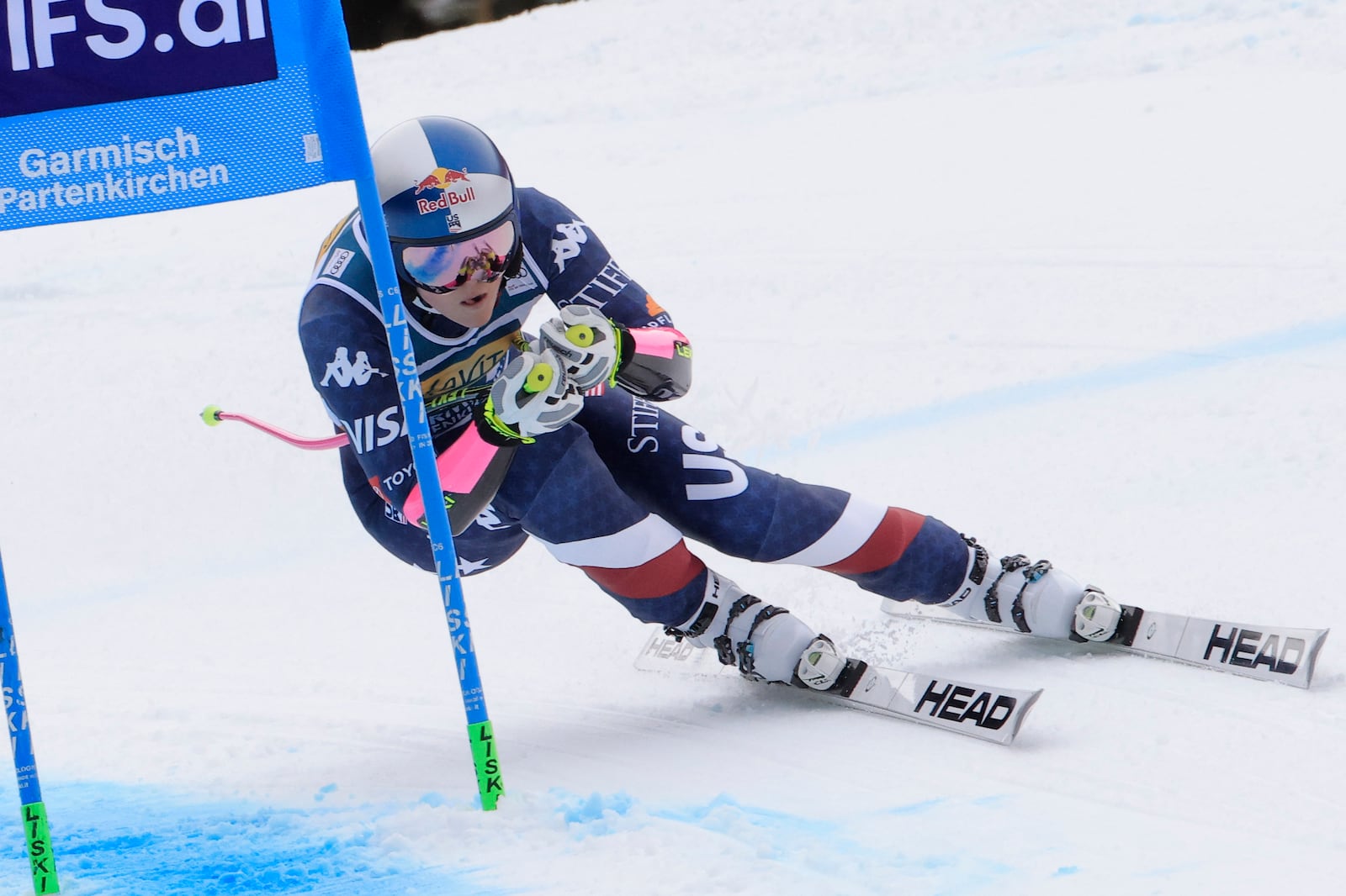 United States' Lindsey Vonn speeds down the course during an alpine ski, women's World Cup super G, in Garmisch, Germany, Sunday, Jan. 26, 2025. (AP Photo/Giovanni Maria Pizzato)