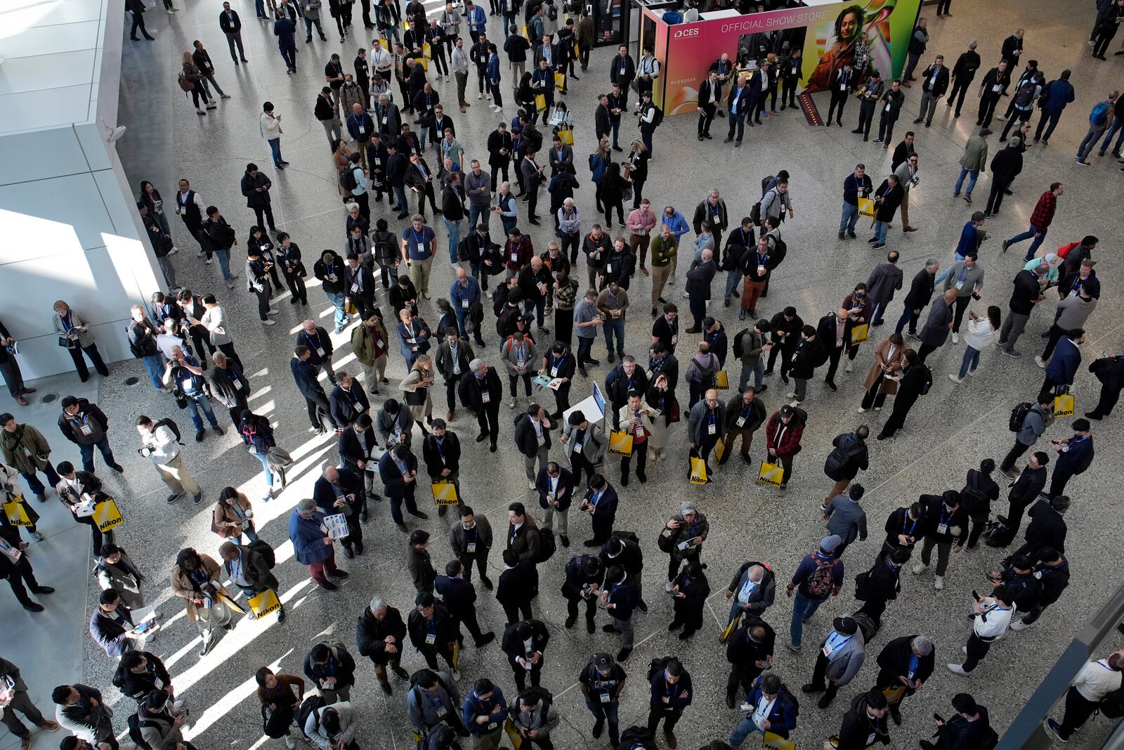 People wait to enter the show floor during the CES tech show Tuesday, Jan. 7, 2025, in Las Vegas. (AP Photo/John Locher)