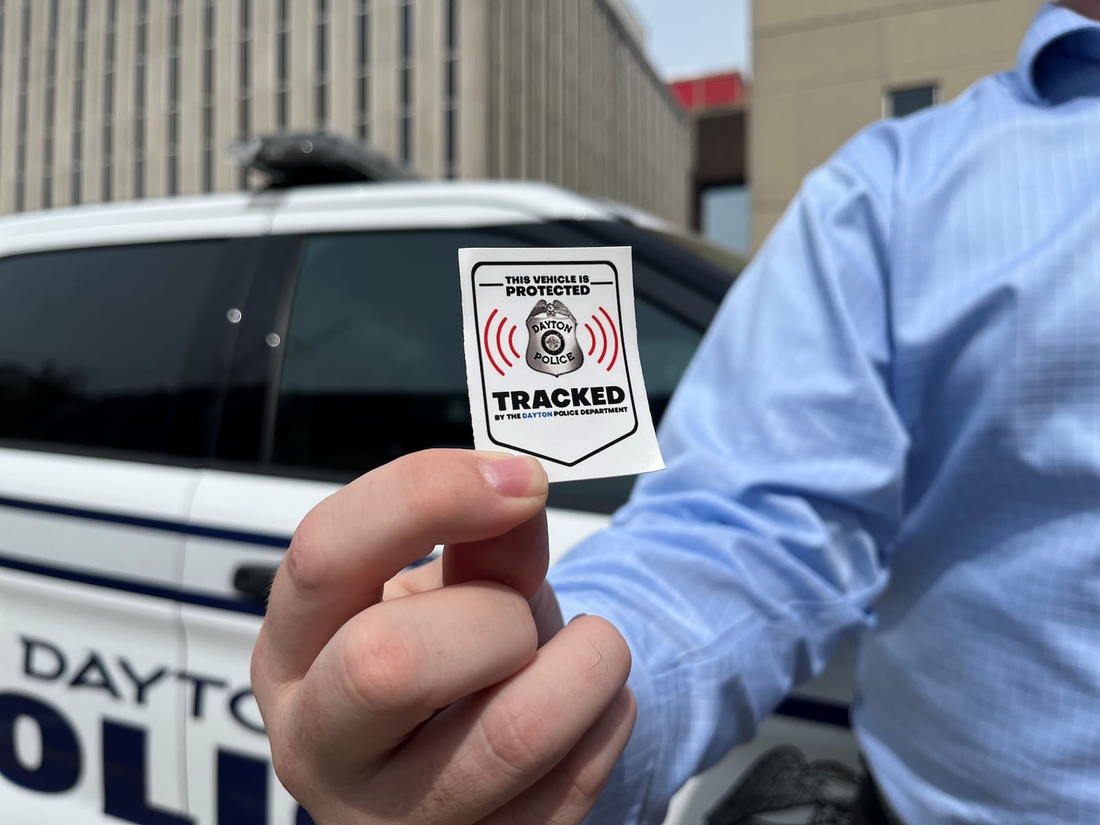 Dayton police are encouraging residents to register their cars and trucks in a free new program that streamlines the process police use to track vehicles using their GPS systems. Car owners get a sticker they can put on their vehicles saying they participate in the program. CORNELIUS FROLIK / STAFF