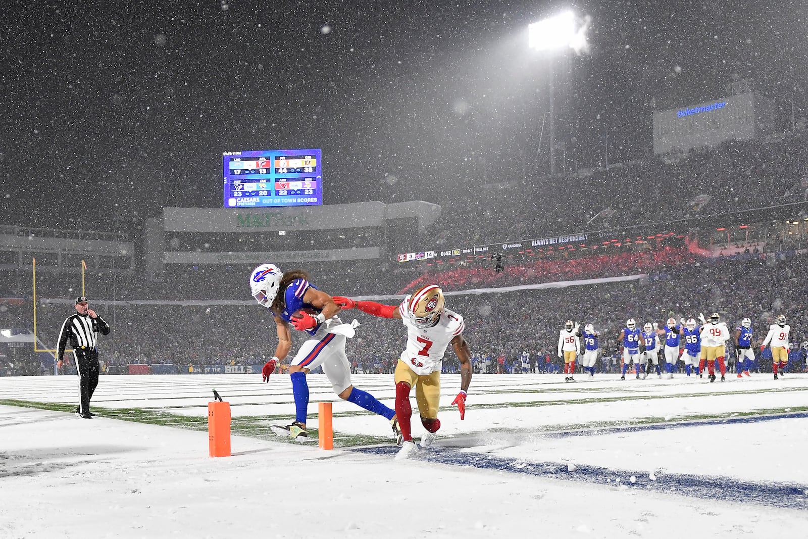 Buffalo Bills wide receiver Mack Hollins, middle left, scores a touchdown past San Francisco 49ers cornerback Charvarius Ward (7) during the first half of an NFL football game in Orchard Park, N.Y., Sunday, Dec. 1, 2024. (AP Photo/Adrian Kraus)