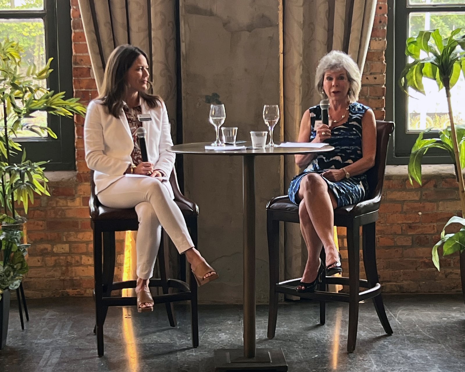 The Powerhouse Event at the Steam Plant in May attracted nearly 50 non-Johnson affiliated attendees and featured a "fireside chat" format with Elizabeth Schaefer (left) and Pat McDonald, honoree and former market president KeyBank Dayton (right). CONTRIBUTED 