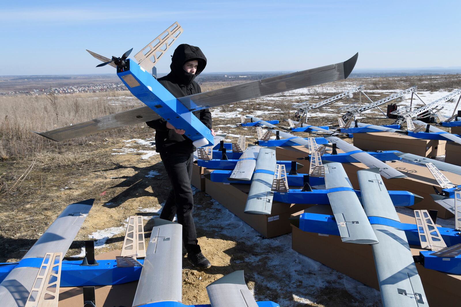 Ukrainian-made fixed-wing Besomar 3210 drone interceptors are handed over to the Armed Forces by Kozytskyi Charity Foundation in an undisclosed location in the Lviv region, western Ukraine, Friday, Feb. 21, 2025. (AP Photo/Mykola Tys)