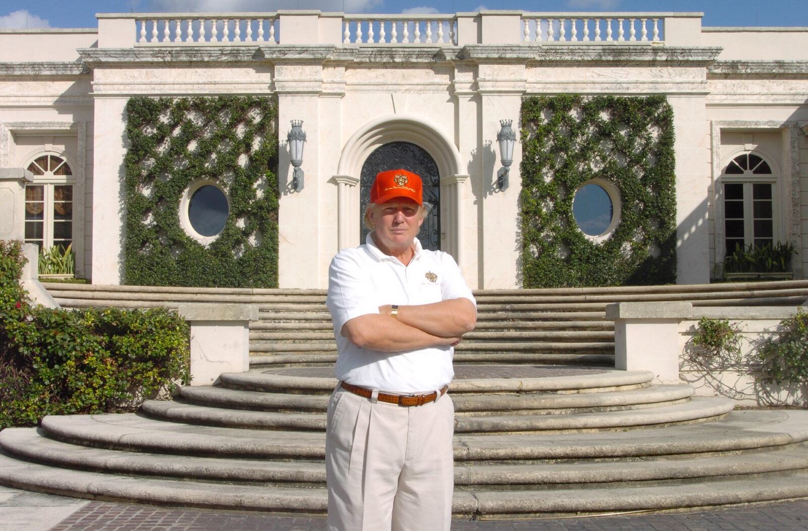 Donald Trump stands in front of 515 N. County Road, the estate he bought at auction for about $41 million, renovated and then sold in 2008 at a recorded $95 million. (Palm Beach Daily News file photo)