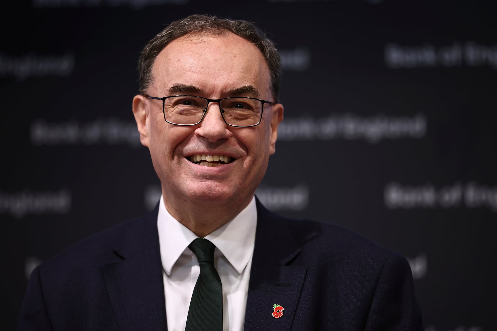 Bank of England Governor Andrew Bailey smiles during the central bank's Monetary Policy Report press conference at the Bank of England, in London, Thursday, Nov. 7, 2024. (Henry Nicholls/Pool Photo via AP)