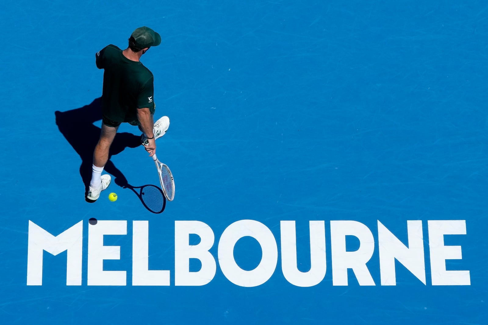 Tommy Paul of the U.S. prepares to serve to Roberto Carballes Baena of Spain during their third round match at the Australian Open tennis championship in Melbourne, Australia, Friday, Jan. 17, 2025. (AP Photo/Manish Swarup)