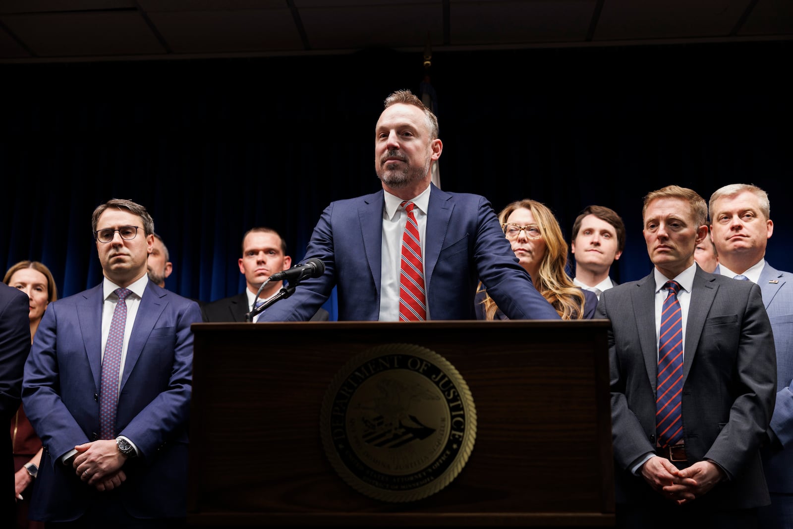 Assistant U.S. Attorney Joseph Thompson, center, answers questions during a press conference at the Minneapolis federal courthouse on Wednesday, March 19, 2025, in Minneapolis, addressing developments in the Feeding Our Future fraud case. (Kerem Yücel/Minnesota Public Radio via AP)