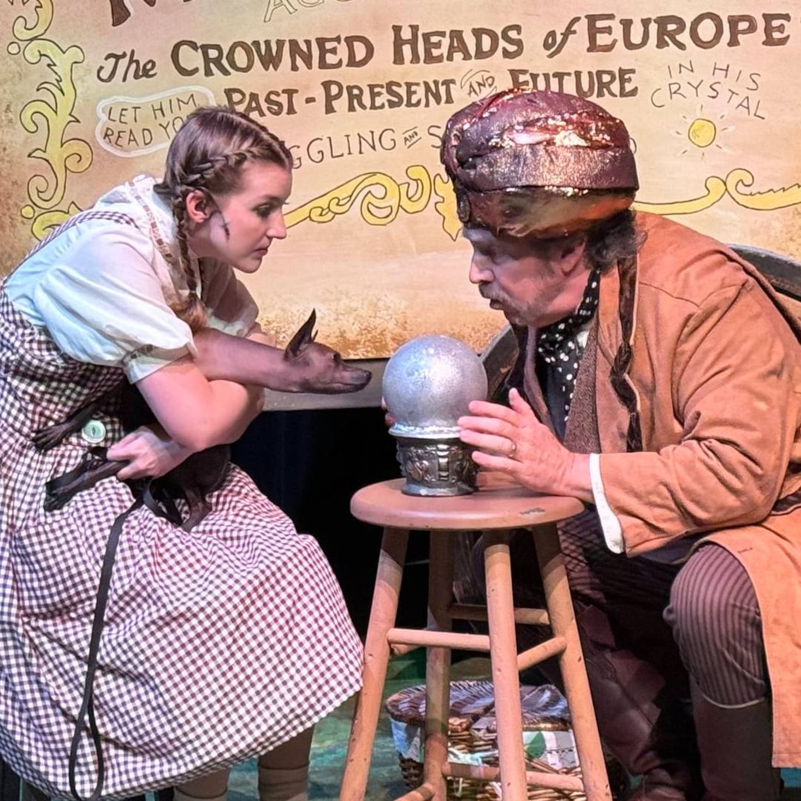 Allison Gabert (Dorothy) and Ed Iverson (Professor Marvel) in La Comedia Dinner Theatre's production of "The Wizard of Oz." PHOTO BY JUSTIN WALTON