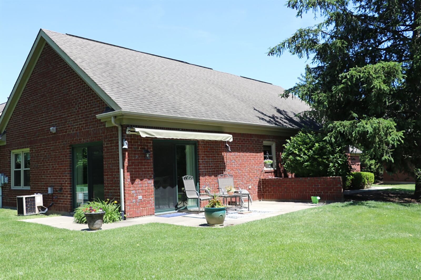 The corner unit has a sunny dining area with two sets of patio doors that provide panoramic views of mature trees, common areas and the corral fenced fairway of the community golf course. CONTRIBUTED PHOTO BY KATHY TYLER