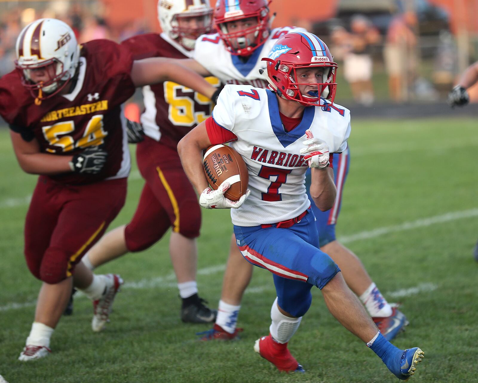 Northwestern’s Eli Berner runs for a first down at Northeastern. BILL LACKEY/STAFF