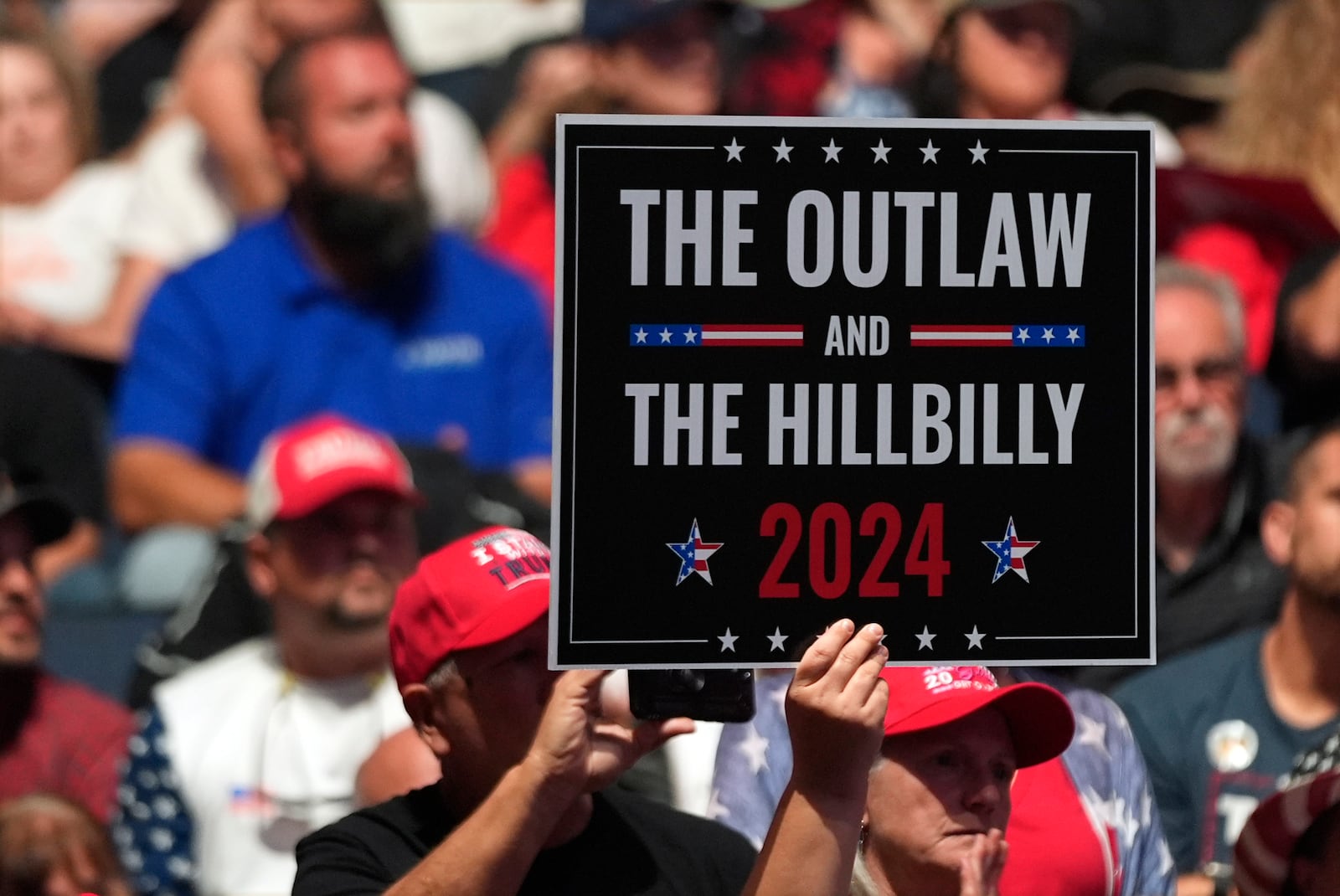 Supporters arrive before Republican presidential nominee former President Donald Trump speaks at a Turning Point Action campaign rally, Wednesday, Oct. 23, 2024, in Duluth, Ga. (AP Photo/Alex Brandon)