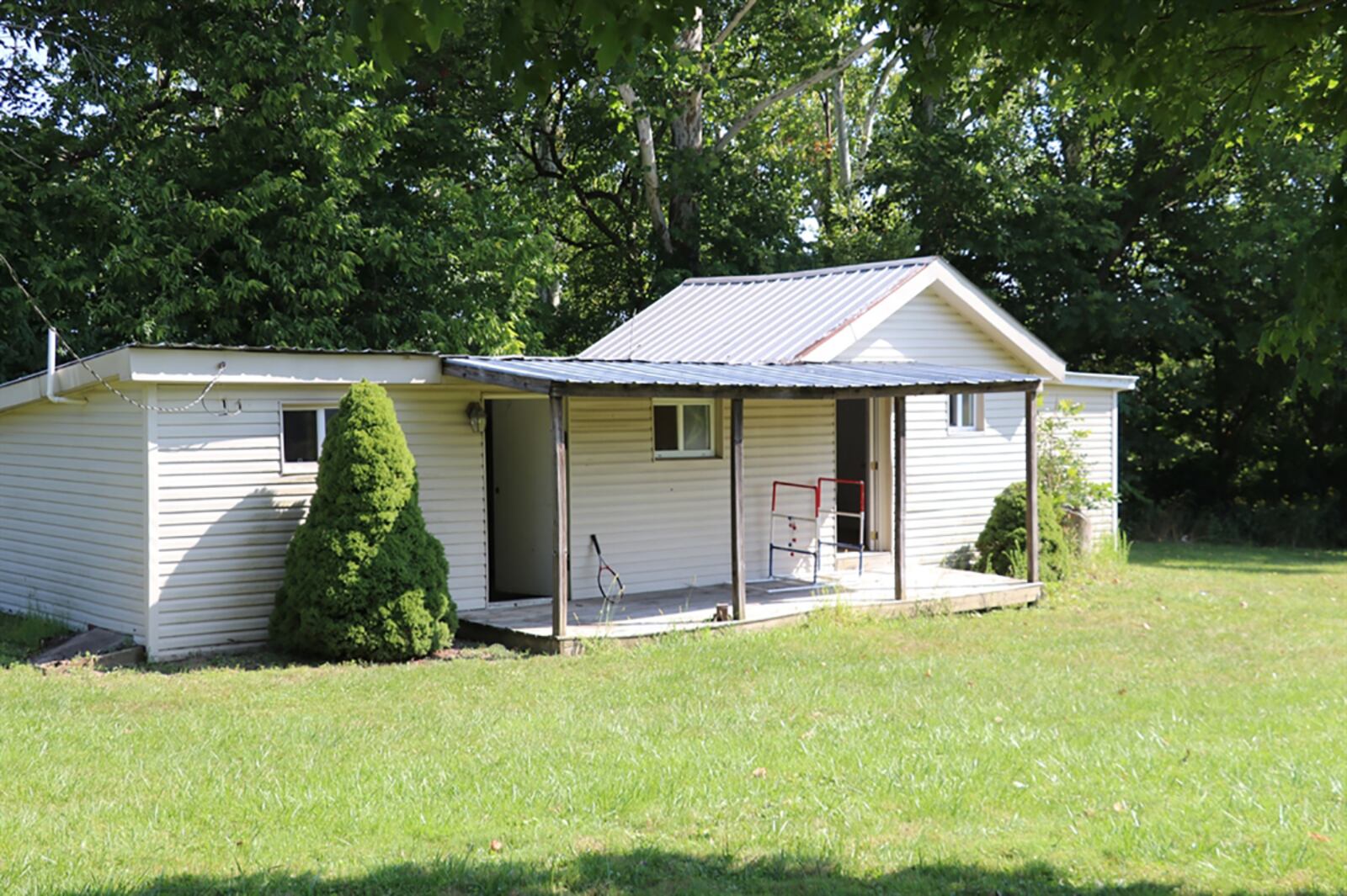 The property includes a metal pole barn, a stable, a garden shed, a tractor shed with an attached lean-to and a guest house with a metal roof and front porch. The guest house has plumbing and electric but does need some renovation. CONTRIBUTED PHOTO BY KATHY TYLER