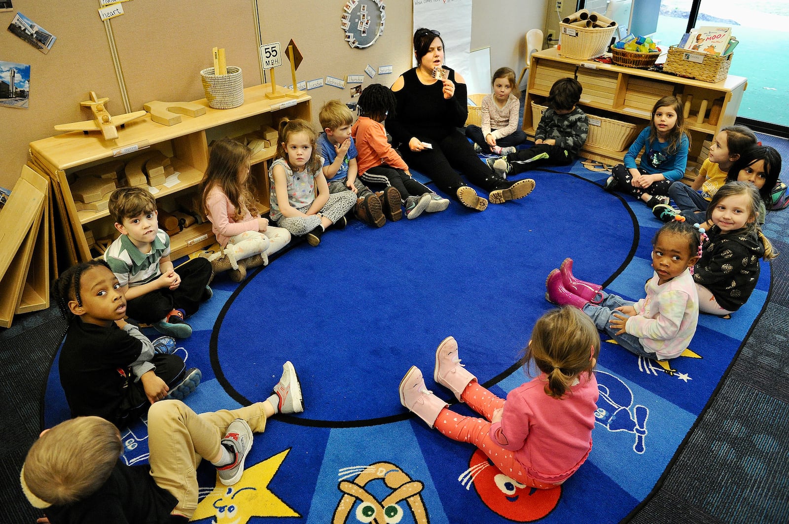 Kalyn George, a teacher at the Sinclair Mini University works with childern Wednesday March 9, 2022. MARSHALL GORBY\STAFF