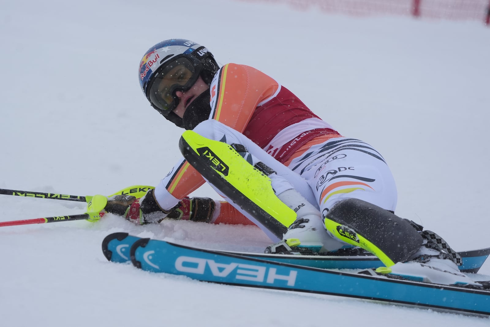 Germany's Emma Aicher after falling on the course during an alpine ski, women's World Cup slalom in Are, Sweden, Sunday, March 9, 2025. (AP Photo/Giovanni Auletta)