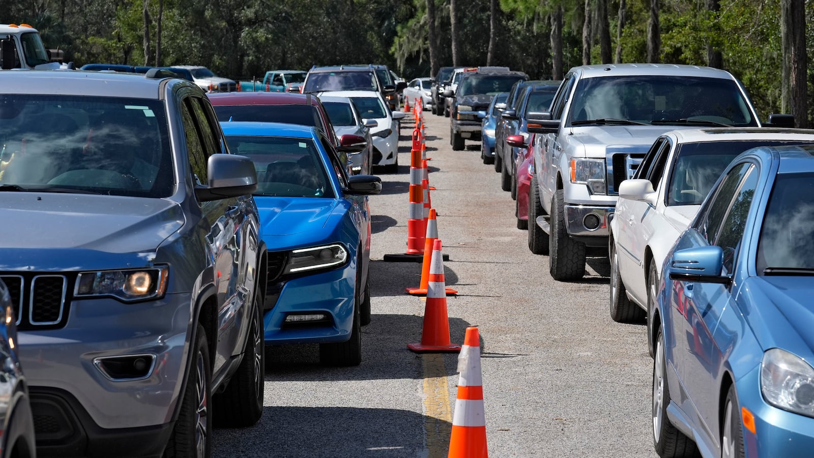 Motorists wait in long lines for fuel at a newly opened depot after Hurricane Milton Saturday, Oct. 12, 2024, in Plant City, Fla. (AP Photo/Chris O'Meara)