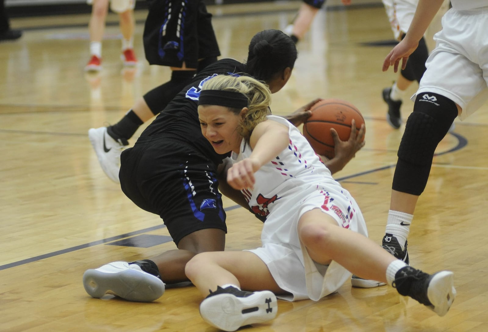 Springboro’s Kennedy Lewis (left) and Tipp’s Kendall Clodfelter. Springboro defeated Tippecanoe 57-38 in the 16th Annual Premier Health Flyin to the Hoop at Trent Arena in Kettering on Sat., Jan. 13, 2018. MARC PENDLETON / STAFF