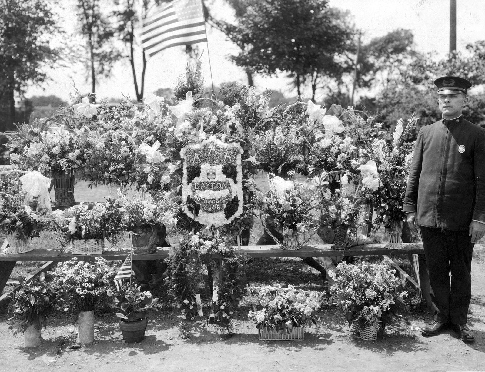 Rudy Wurstner poses with 14 floral arrangements on the day he was promoted to chief of the Dayton Police Department in 1925. CONTRIBUTED PHOTO / DAYTON POLICE HISTORY FOUNDATION