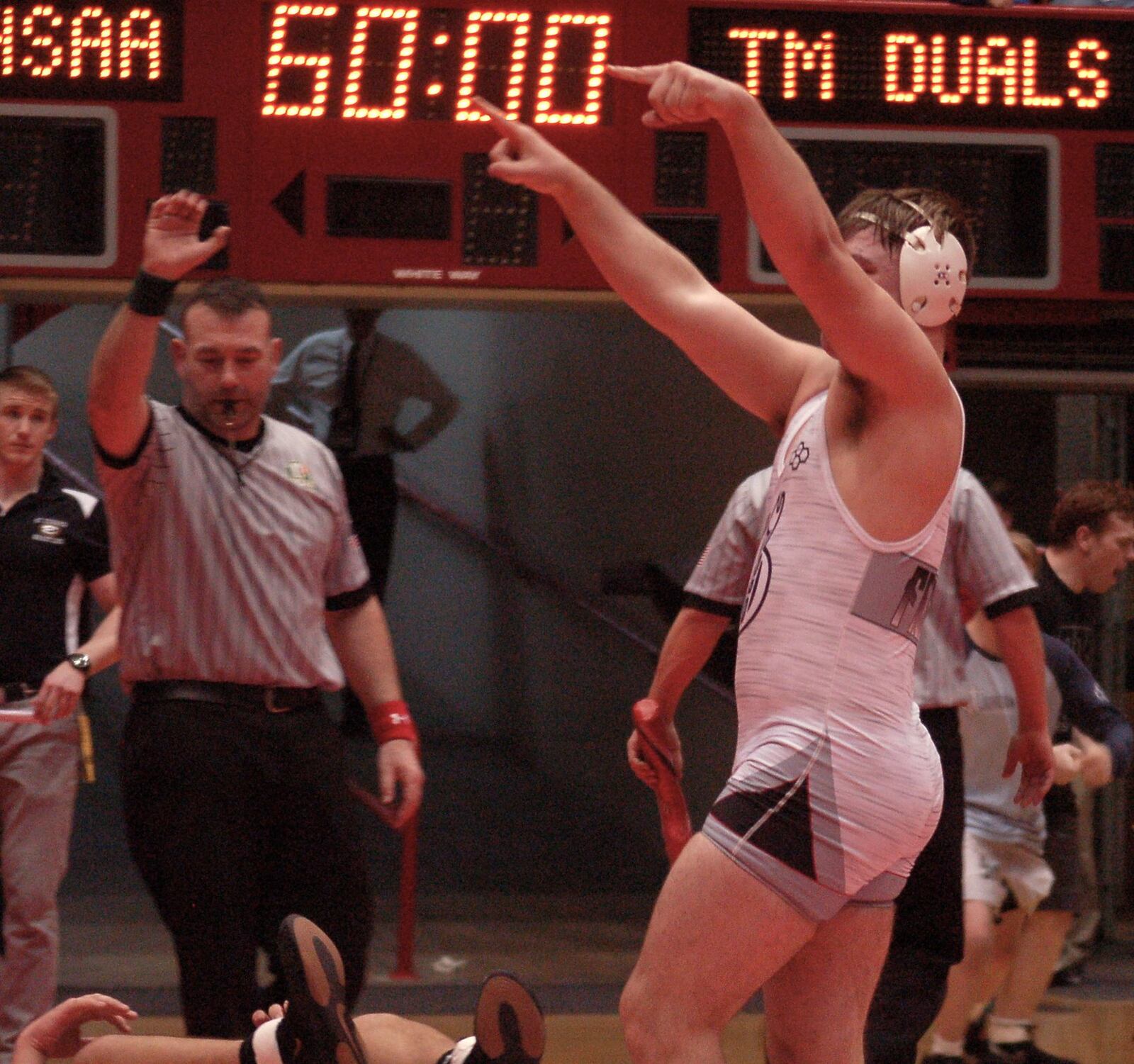 Graham’s Johnny Shafer raises his arms after clinching the D-I state title with a 3-1 win at 285 Sunday at St. John’s Arena. John Cummings/CONTRIBUTED