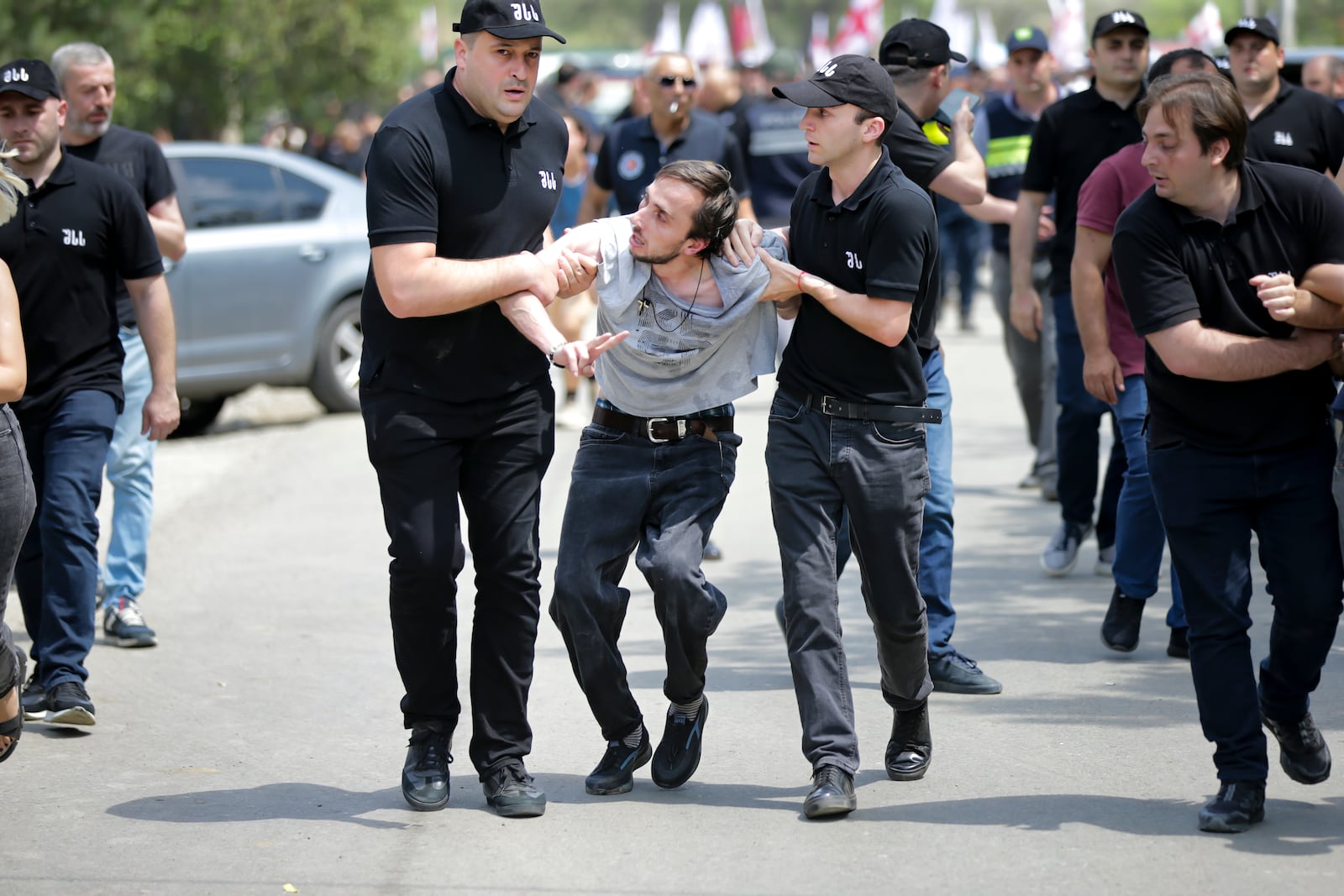 FILE - Police detain an opponent of gay rights s and tried to interfere a pride event in Tbilisi, Georgia, on July 8, 2023. (AP Photo/Zurab Tsertsvadze, File)