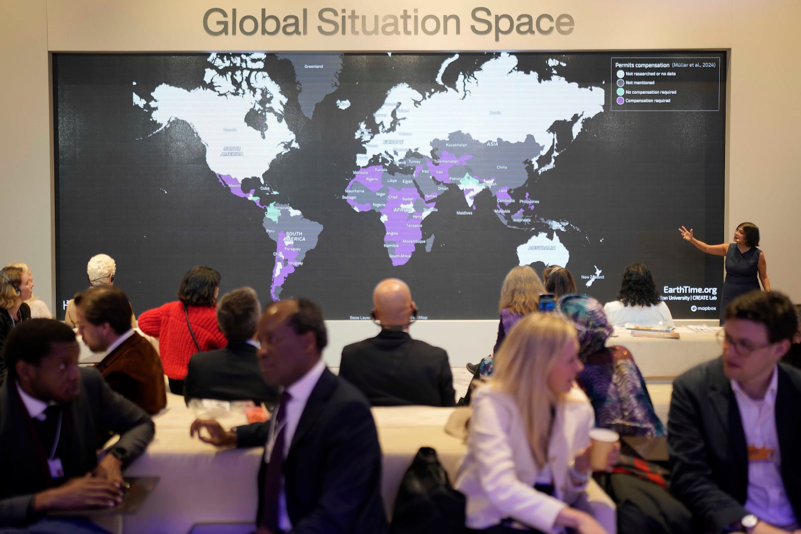 People attend the Global Situation Space session at the Annual Meeting of World Economic Forum in Davos, Switzerland, Thursday, Jan. 23, 2025. (AP Photo/Markus Schreiber)