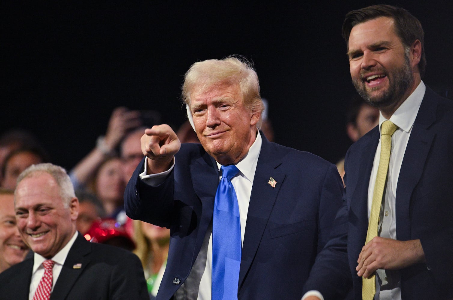 
                        Former President Donald Trump with Sen. JD Vance (R-Ohio), right, the Republican vice presidential nominee, and Rep. Steve Scalise (R-La.), left, on the second night of the Republican National Convention at the Fiserv Forum in Milwaukee, Wis., on Tuesday, July 16, 2024. Crime and immigration were the focus of speeches on the second day of the Republican National Convention. (Jon Cherry/The New York Times)
                      