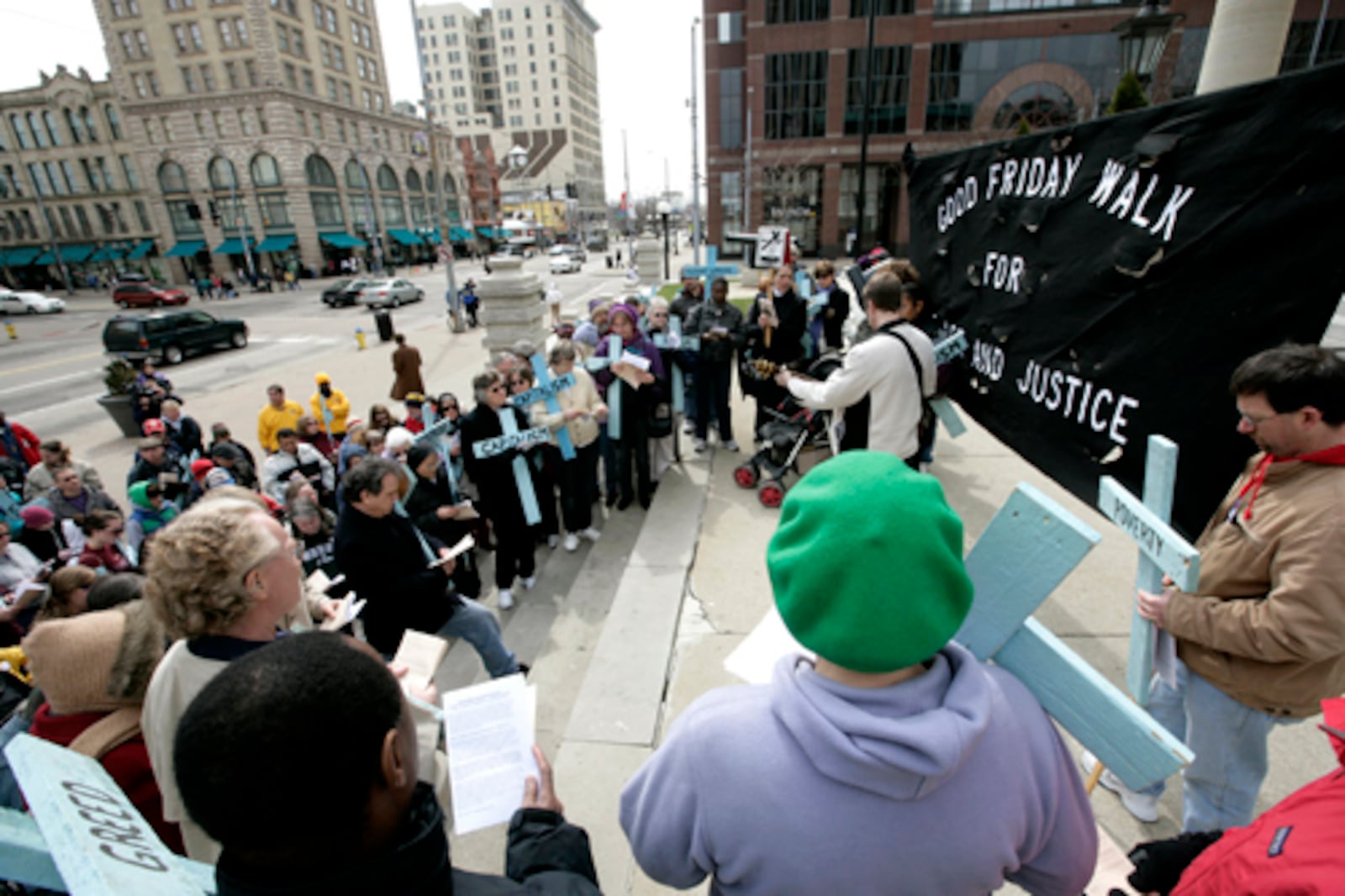 Participants gather annually in downtown Dayton for a Walk for Justice and Peace on Good Friday to bring awareness to social issues. FILE
