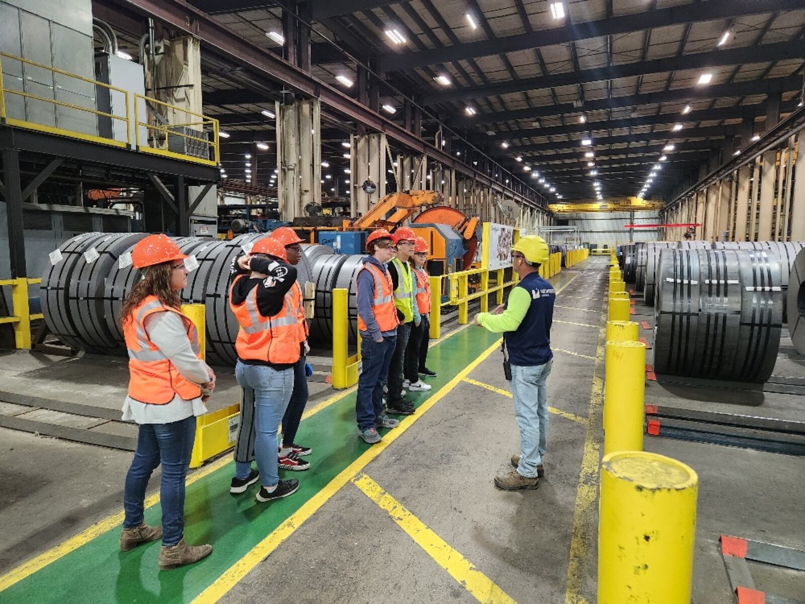 A representative from ??? gives students a tour during one of the National Manufacturing Day/Month programs celebrated by the Chamber of Commerce serving Middletown, Monroe and Trenton. SUBMITTED PHOTO