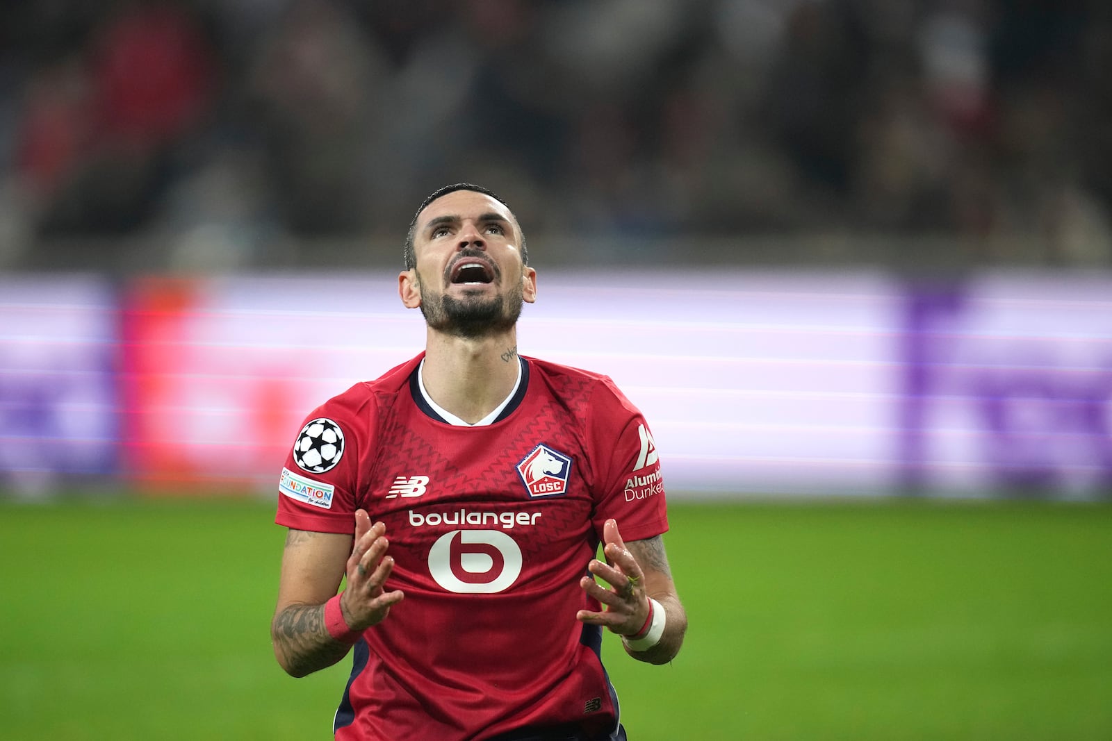 Lille's Remy Cabella reacts during the Champions League soccer match between Lille and Sturm Graz at the Stade Pierre Mauroy in Villeneuve-d'Ascq, outside Lille, northern France, Wednesday, Dec. 11, 2024. (AP Photo/Christophe Ena)