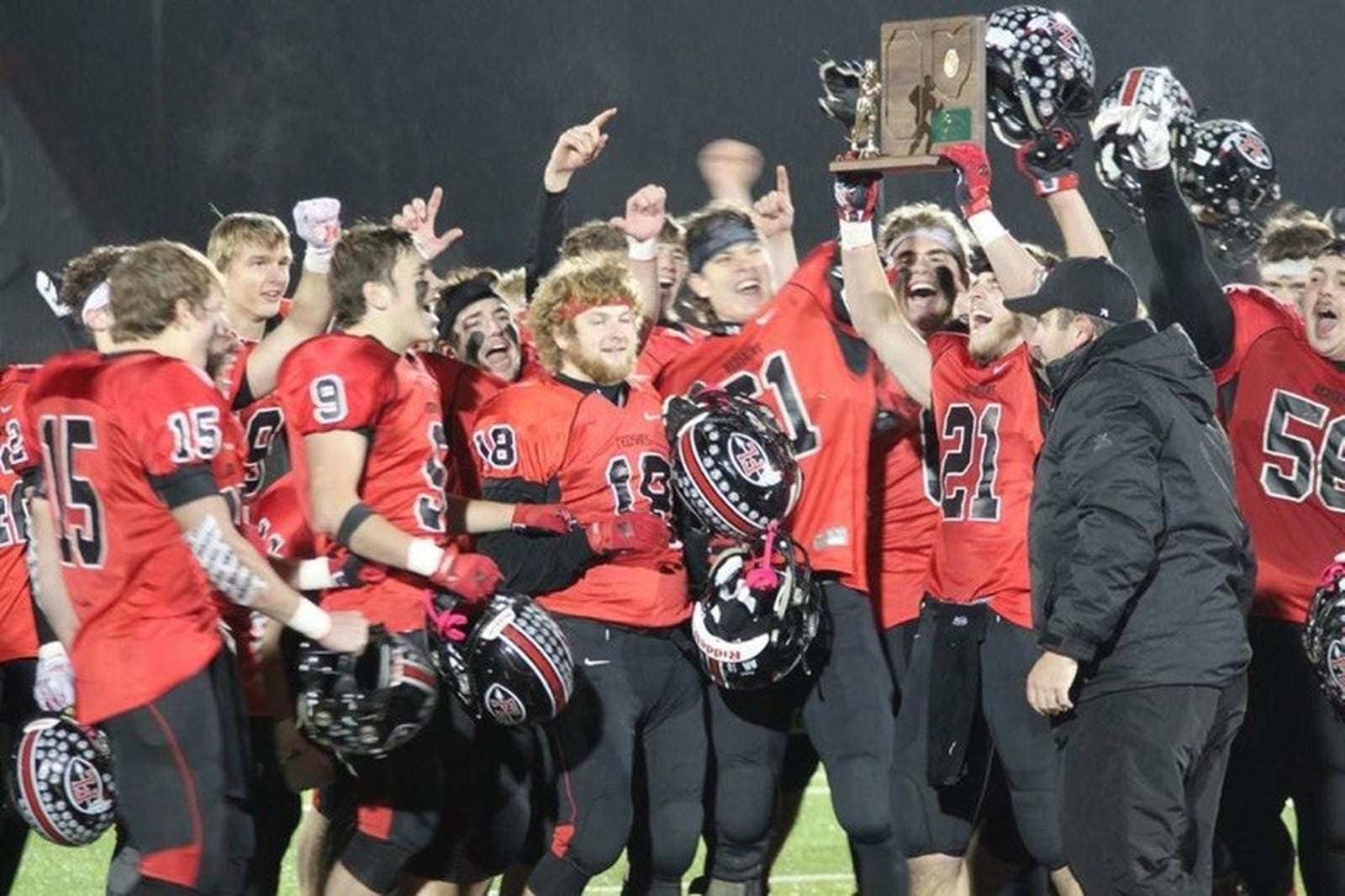 Fort Loramie coach Spencer Wells (right) and the Redskins celebrate a 48-20 defeat of Convoy Crestview in a Week 13 high school football playoff game at Lima on Saturday, Nov. 17, 2018. CONTRIBUTED PHOTO