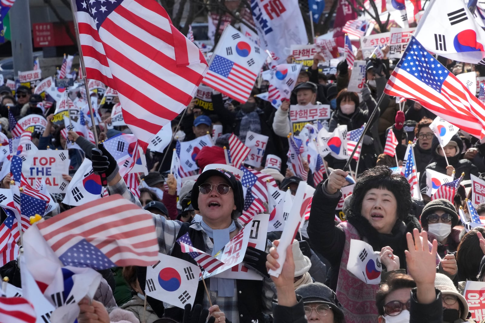 Supporters of impeached South Korean President Yoon Suk Yeol attend a rally to oppose his impeachment in Seoul, South Korea, Saturday, Jan. 25, 2025. (AP Photo/Ahn Young-joon)