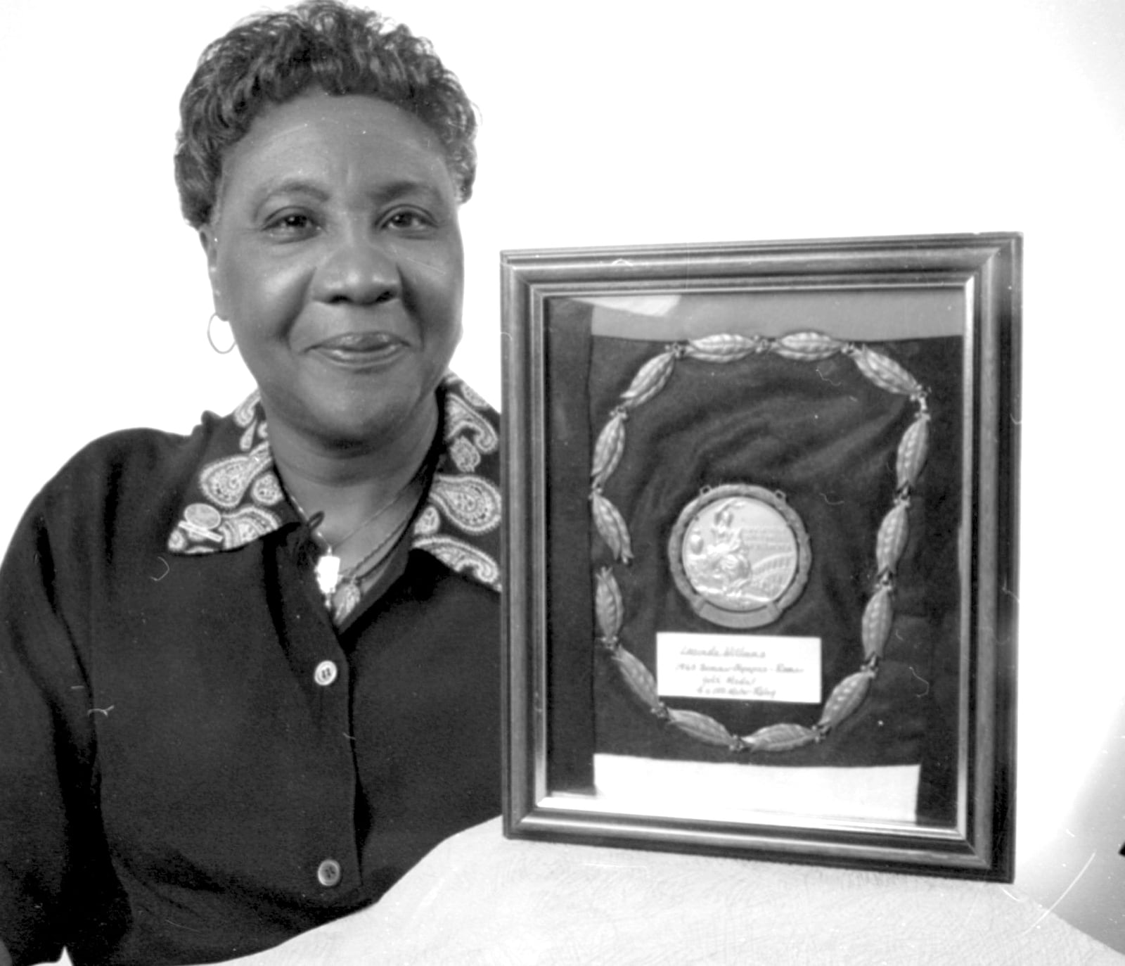 Lucinda Williams Adams was photographed with her Olympic gold medal in 1995. DAYTON DAILY NEWS ARCHIVE