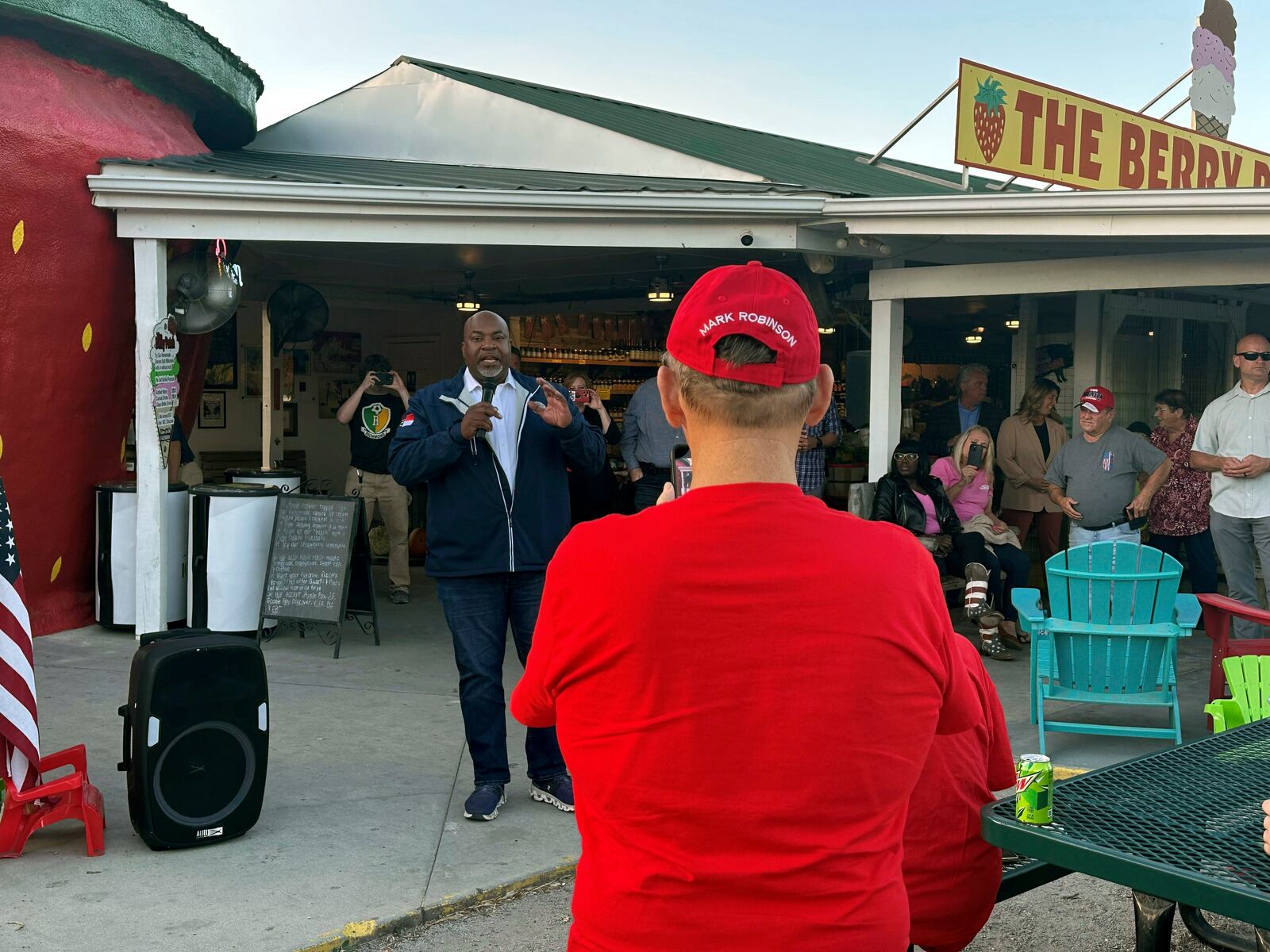 North Carolina Republican gubernatorial nominee and Lt. Gov. Mark Robinson addresses supporters at The Berry Patch ice cream stand and produce market in Ellerbe, N.C., Wednesday, Oct. 30. 2024 (AP Photo/Gary D. Robertson)