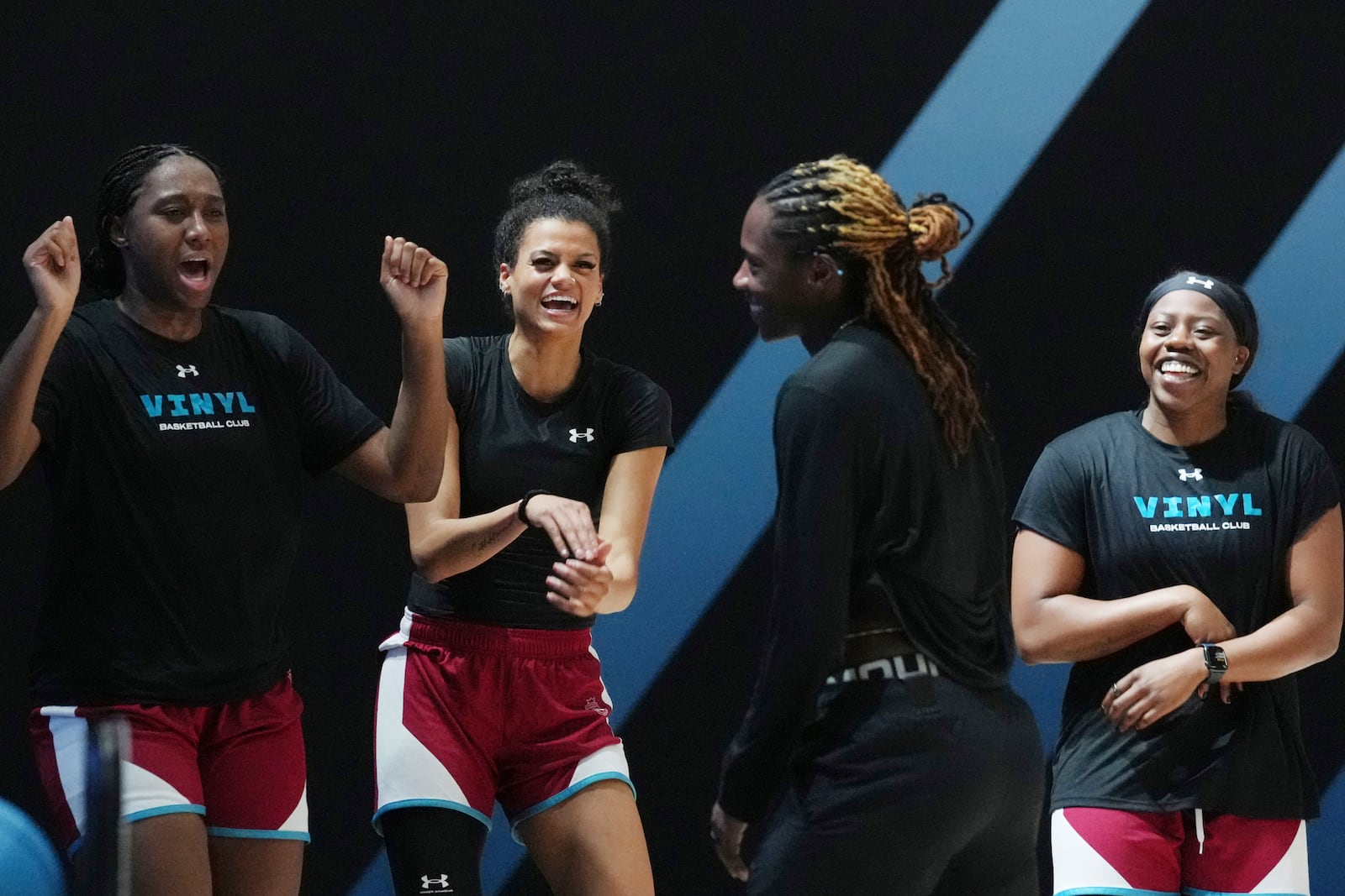 Vinyl players celebrate Rhyne Howard after a practice session, Thursday, Jan. 16, 2025, in Medley, Fla., as the new 3-on-3 women's basketball league Unrivaled tips off this weekend. (AP Photo/Marta Lavandier)