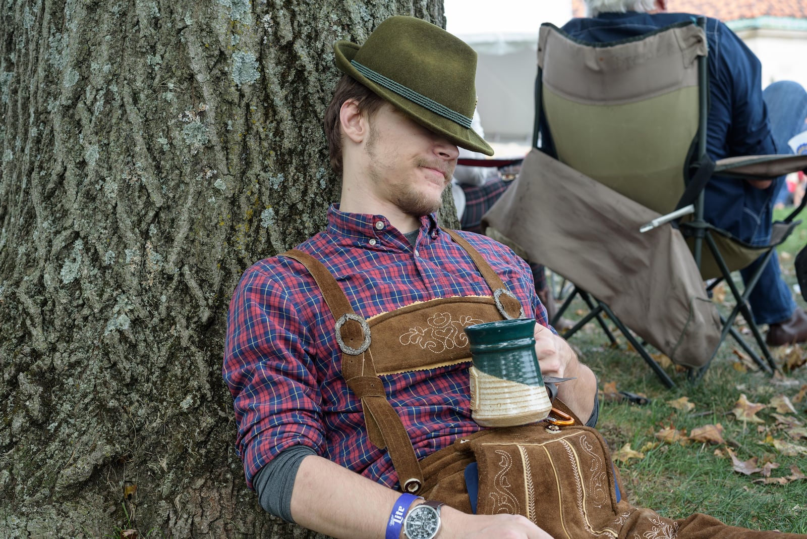 A guest takes time to rest at the Dayton Art Institute’s Oktoberfest, which will be held Sept. 22-24. TOM GILLIAM / CONTRIBUTING PHOTOGRAPHER