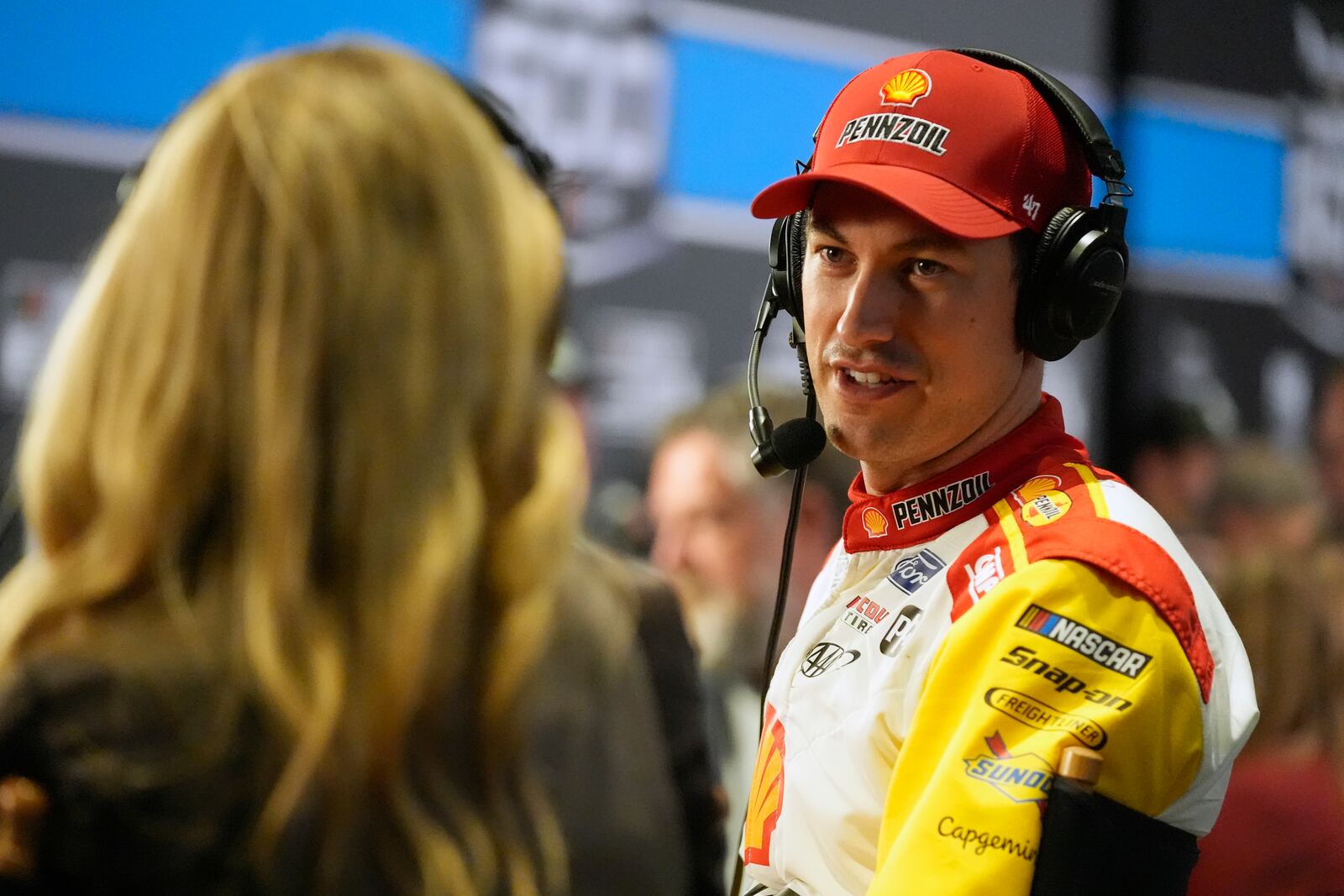 Joey Logano answers questions during an interview at media day for the NASCAR Daytona 500 auto race, Wednesday, Feb. 12, 2025, at Daytona International Speedway in Daytona Beach, Fla. (AP Photo/John Raoux)