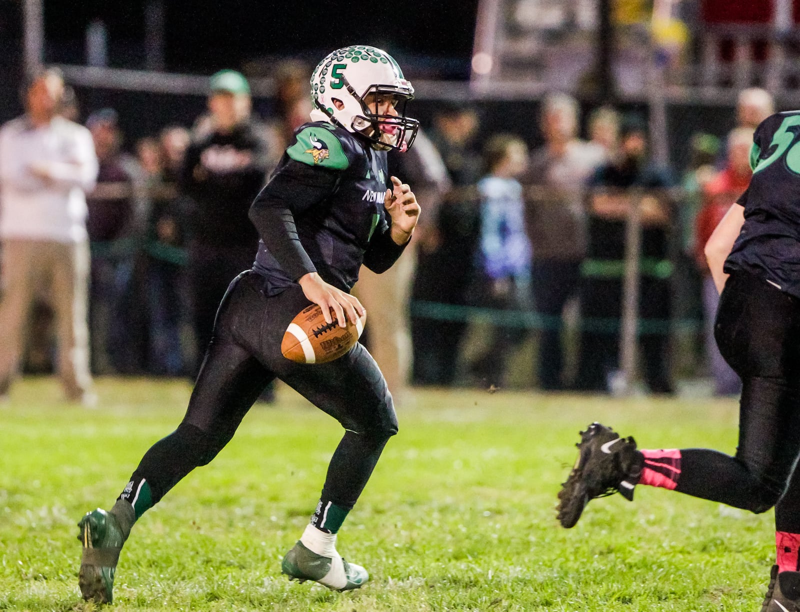 New Miami quarterback Trey Robinette looks for an open receiver during a game against Cincinnati Country Day on Friday, Oct. 25, 2019, at New Miami High School. New Miami defeated Cincinnati Country Day 34-6 and is 9-0 for the first time in school history. NICK GRAHAM/STAFF