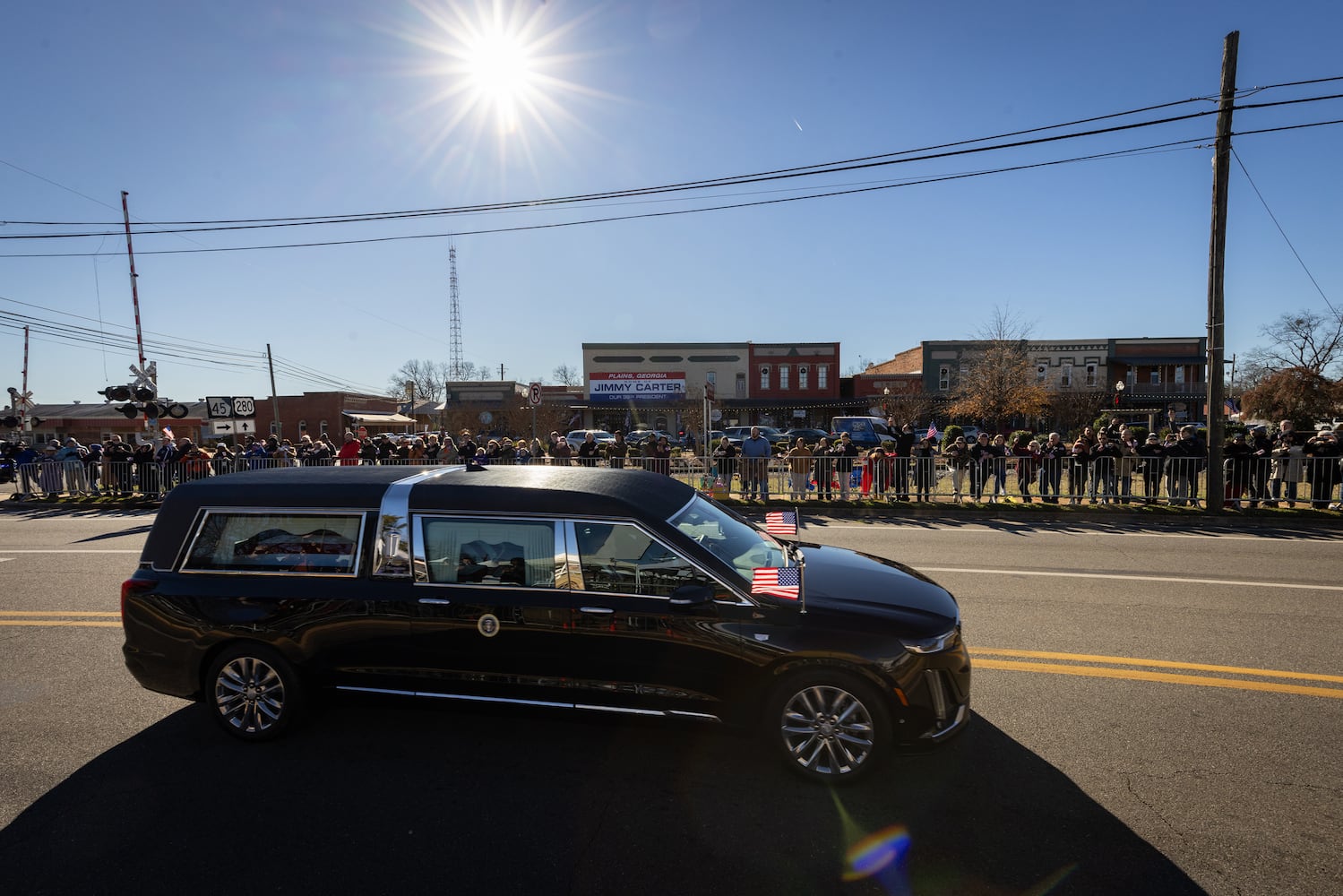 The hearse carrying the  casket of former President Jimmy Carter moves through Plains, Ga., Saturday, Jan. 4, 2025. (Dustin Chambers/The New York Times)