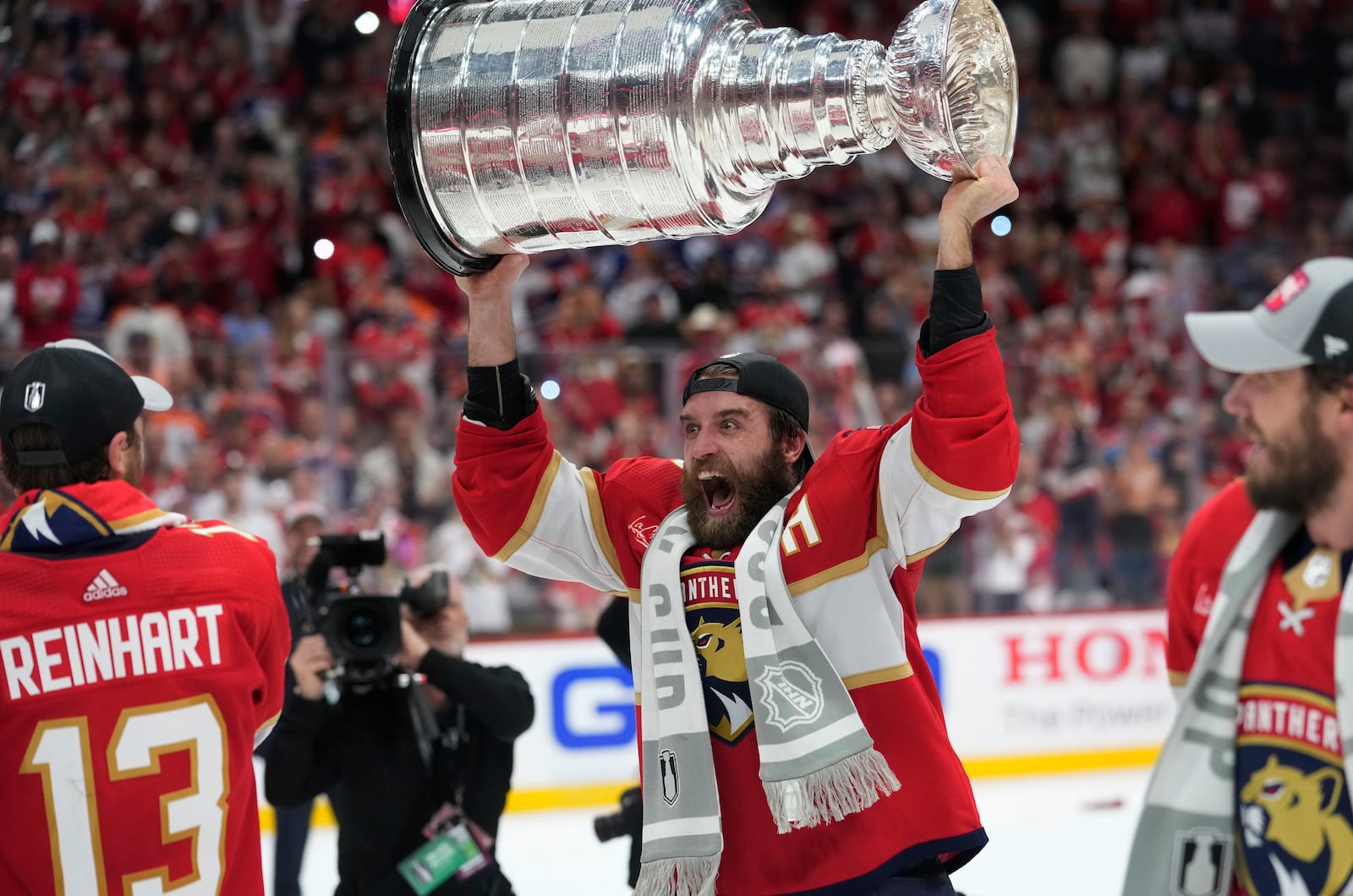 FILE - Florida Panthers defenseman Aaron Ekblad raises the NHL hockey Stanley Cup trophy after defeating the Edmonton Oilers in Game 7 of the Final, Monday, June 24, 2024, in Sunrise, Fla. (AP Photo/Wilfredo Lee, File)