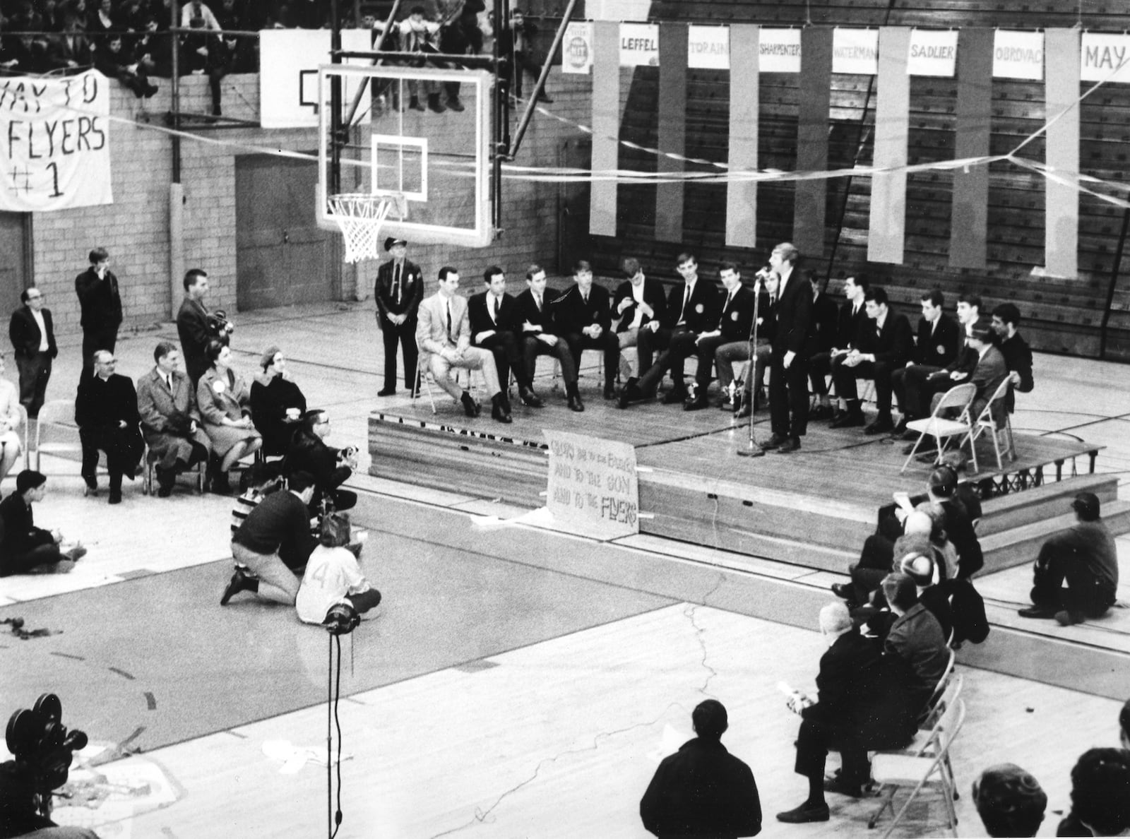 The University of Dayton Flyers men's basketball team won the 1968 National Invitational Tournament.  Flyer fans crowded the UD Fieldhouse to welcome the victorious team home.