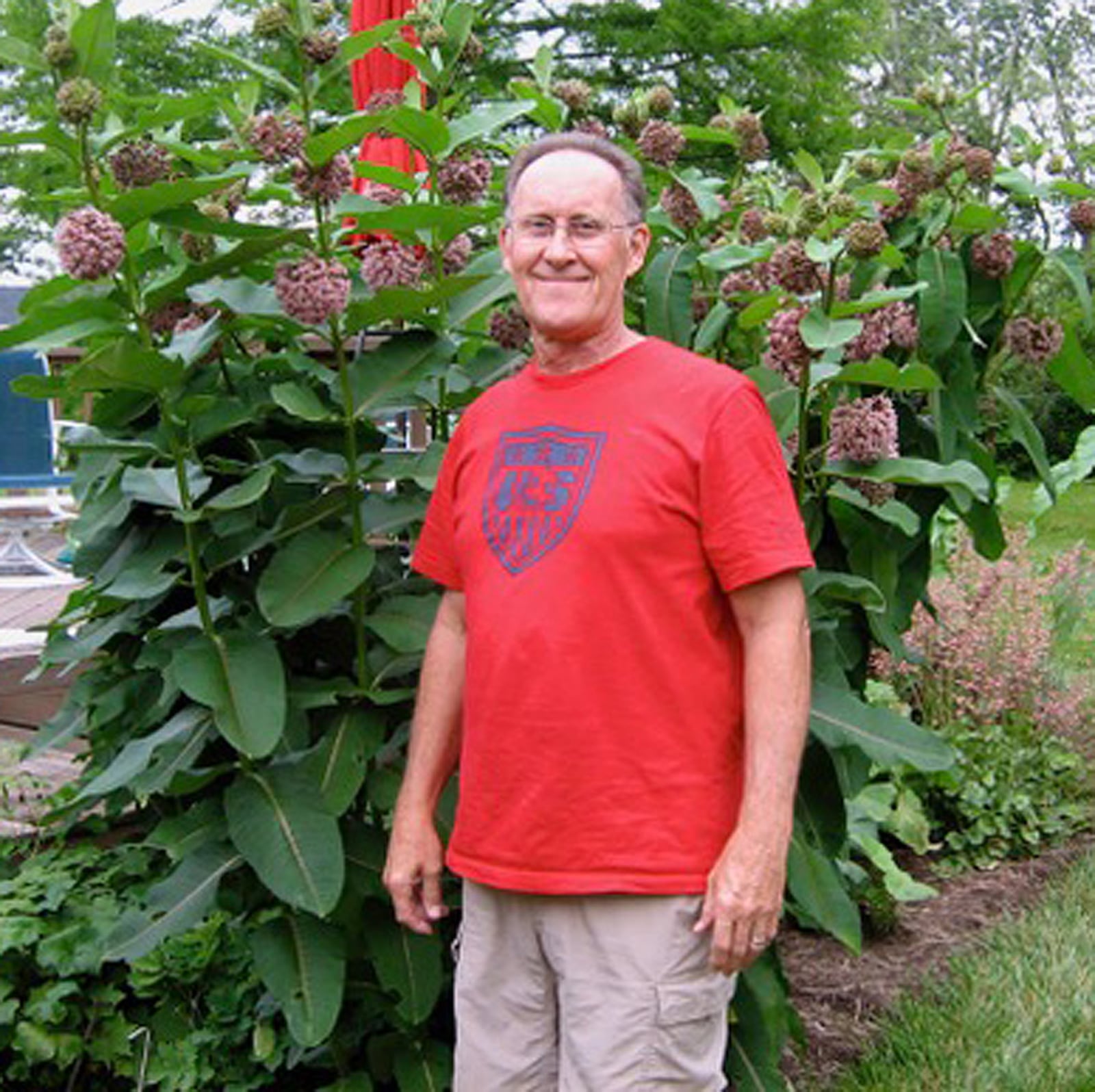 Dan Hill stands in front of a patch of common milkweed, one of several areas where he searches for monarch eggs. Hill lives near Germantown. CONTRIBUTED