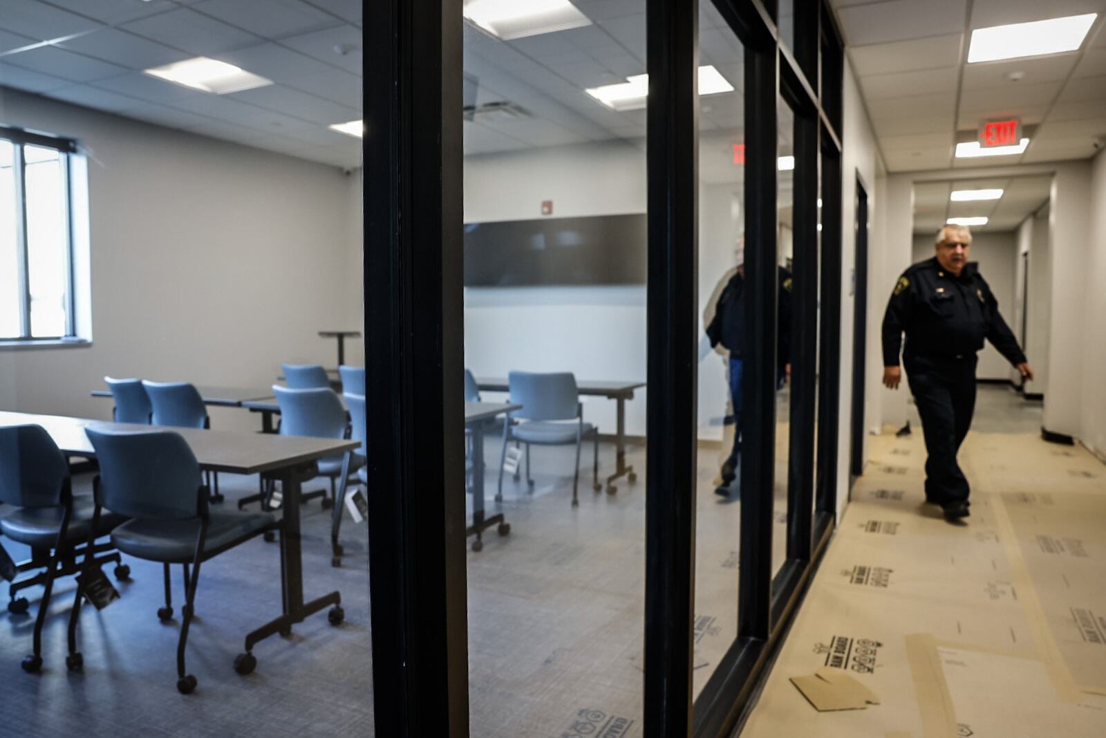 Clearcreek Twp. police Chief John Terrill walks out of the new squad room at the new police station. The new Clearcreek Twp. police station is nearly complete. The 18,000 square-foot, $5.6 million facility is on Bunnell Hill Road on the north side of the township's government Center campus. JIM NOELKER/STAFF