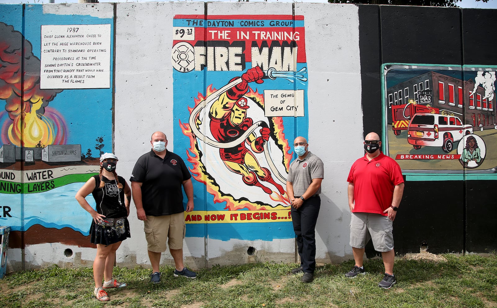 Tiffany Clark, a Dayton mural artist, (left) and members of Dayton Fire Fighters Local 136, Dennis Bristow, Marques Kincaid and Jim Burneka at a new mural on Buckeye Street commemorating the history of the Dayton Fire Departments. Dayton Fire Fighters Local 136 has teamed up with mural artist Tiffany Clark to create a 20-panel mural along Buckeye Street between Main and Warren streets. The mural will tell the history of the Dayton Fire Department in vintage comic book style.  LISA POWELL / STAFF