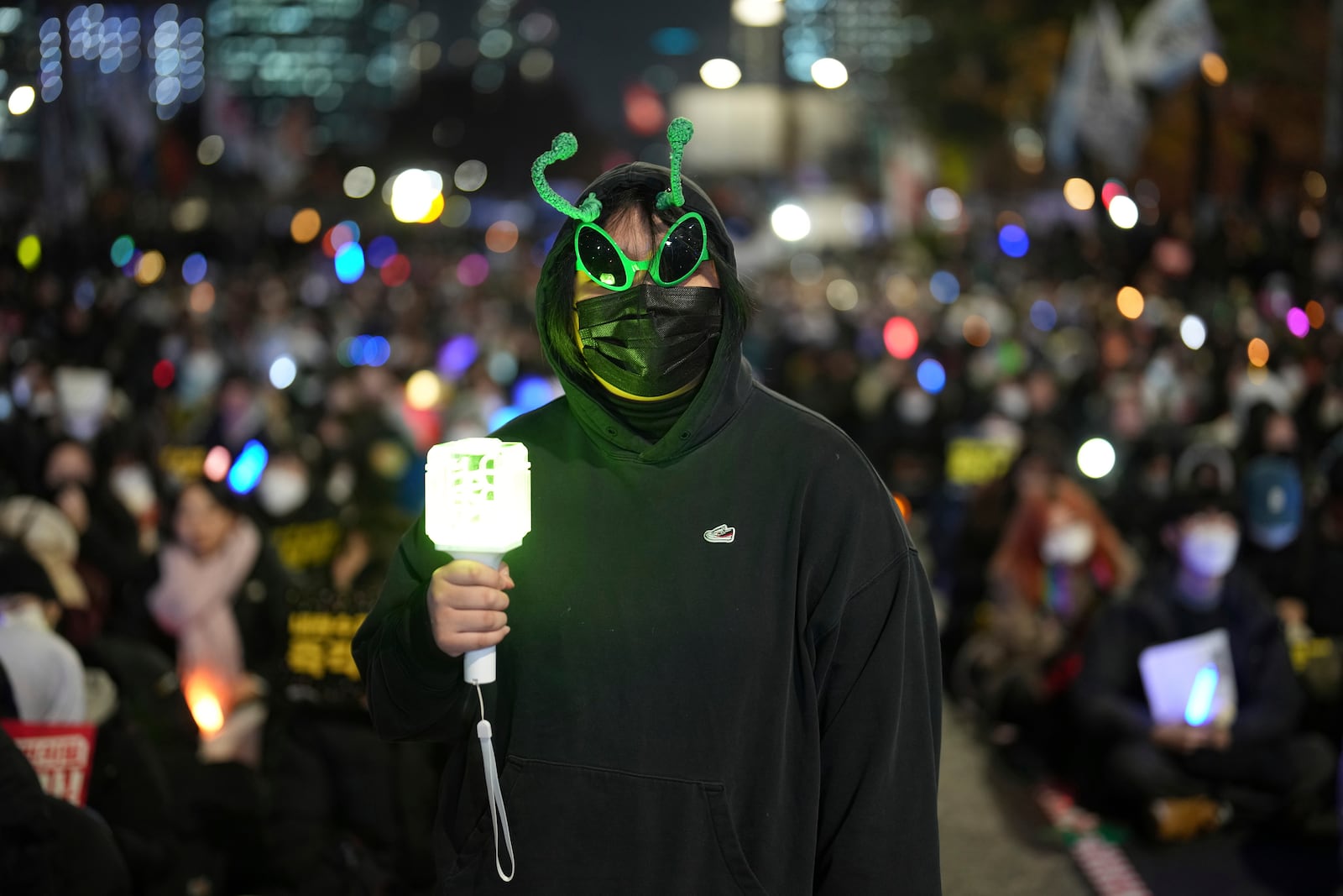 FILE- Lee Seo-jin, 19, a student, poses for a photo during a rally to demand South Korean President Yoon Suk Yeol's impeachment outside the National Assembly in Seoul, South Korea, Dec. 11, 2024. (AP Photo/Lee Jin-man, File)